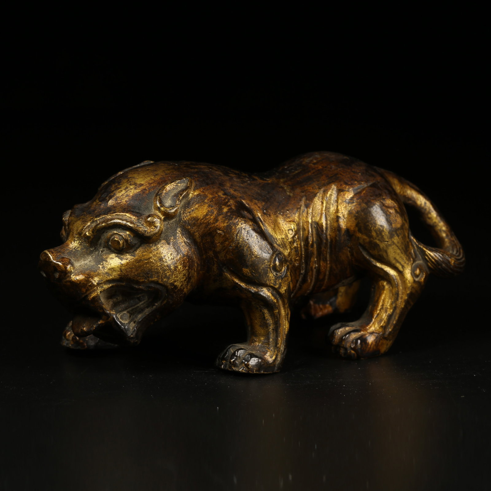 A GILT-BRONZE AUSPICIOUS BEAST ORNAMENT (1 of 8)