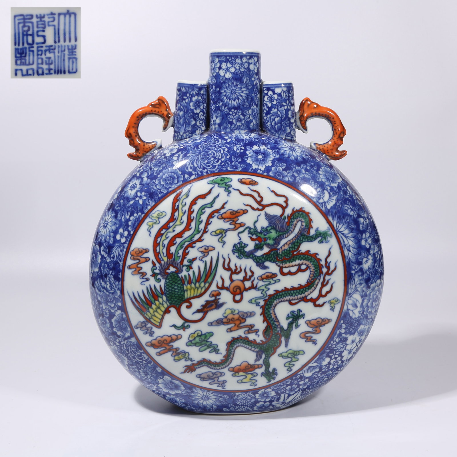 A BLUE-AND-WHITE WITH OPEN-WINDOW DOUCAI DRAGON AND PHOENIX AUSPICIOUS THREE-HOLE FLAT VASE: Blue-and-White with Open-Window Doucai Dragon and Phoenix Auspicious Three-Hole Flat Vase