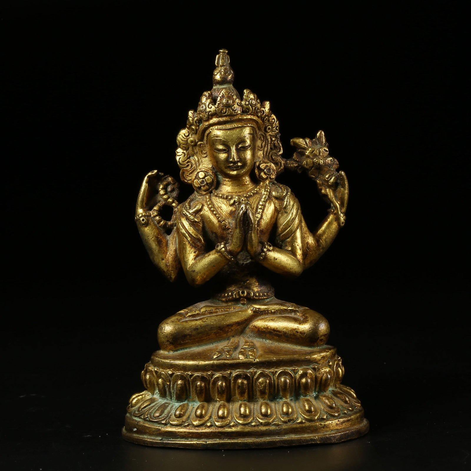 A GILT-BRONZE FOUR-ARMED AVALOKITESHVARA FIGURE: Gilt-Bronze Four-Armed Avalokiteshvara Figure