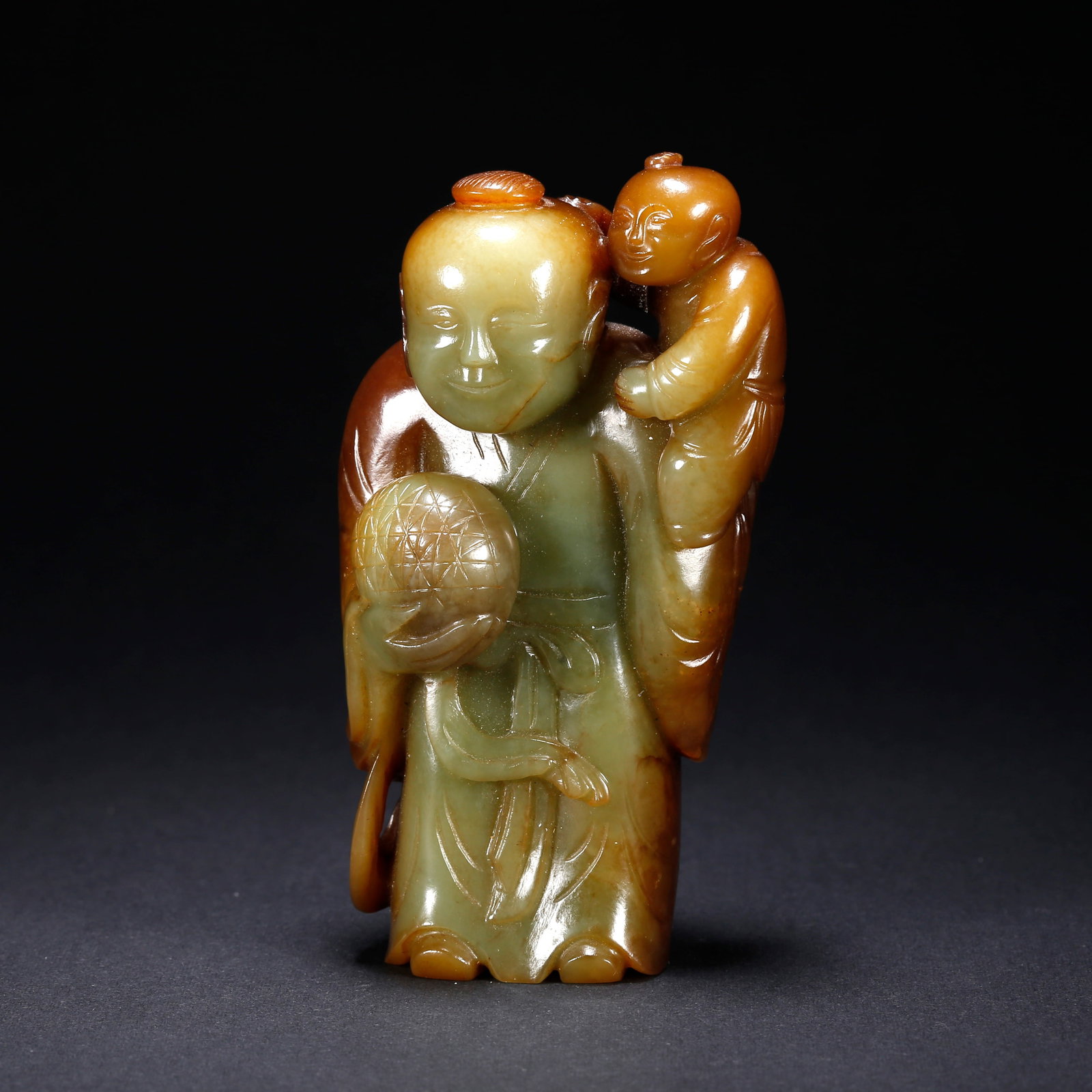 A HETIAN YELLOW JADE FIGURINE: Hetian Yellow Jade Figurine