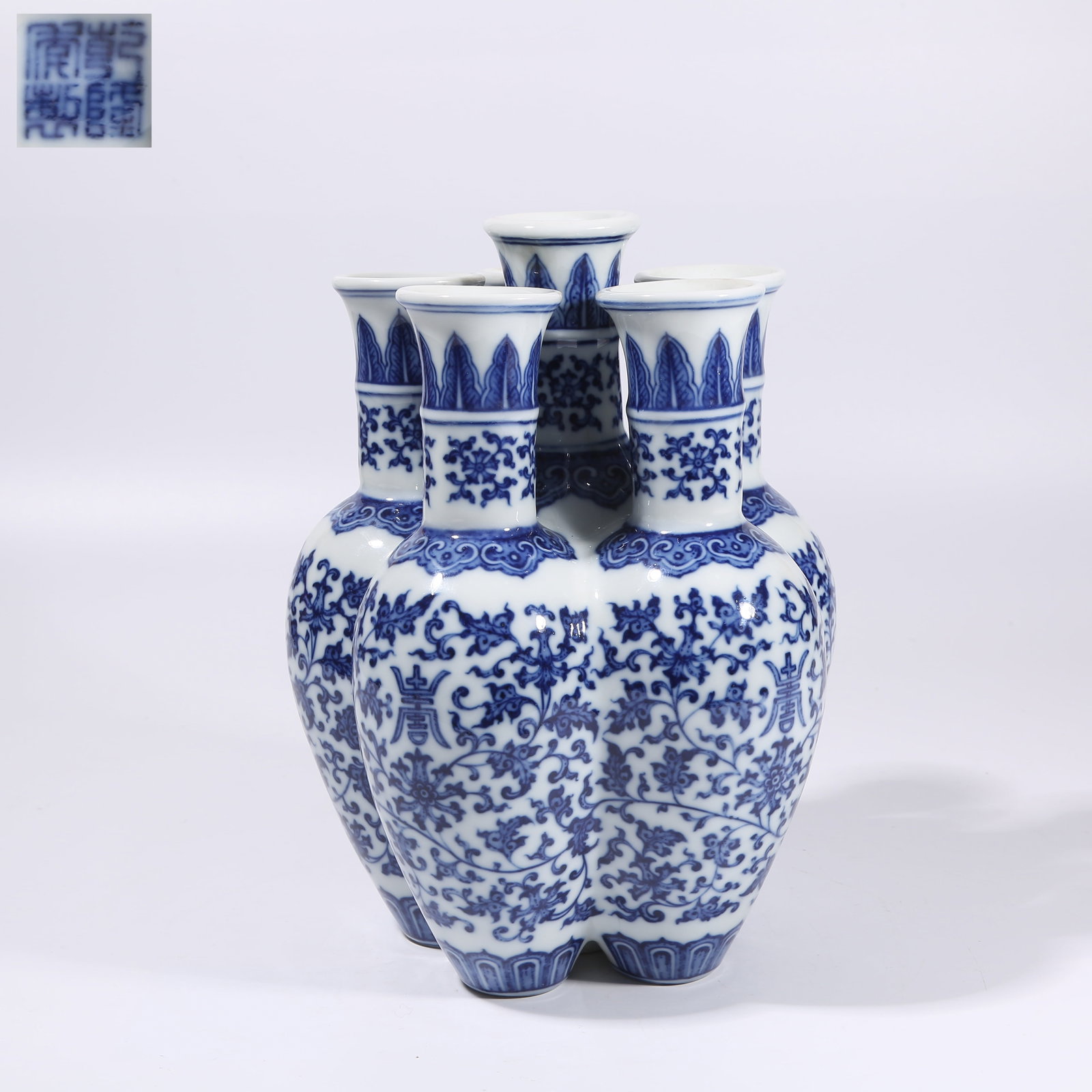 A BLUE-AND-WHITE INTERTWINED FLORAL SIX-HOLE SCREEN: Blue-and-White Intertwined Floral Six-Hole Screen