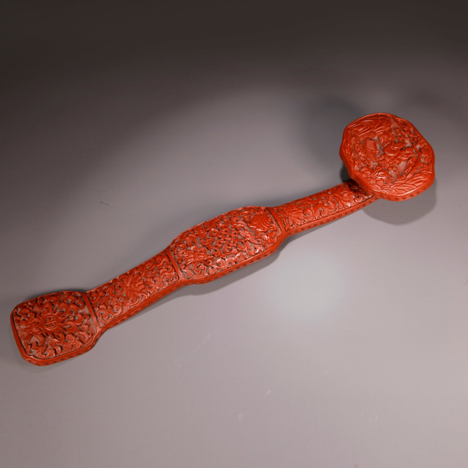 A CARVED RED LACQUER RUYI SCEPTER WITH FIGURE STORY PATTERN (1 of 9)