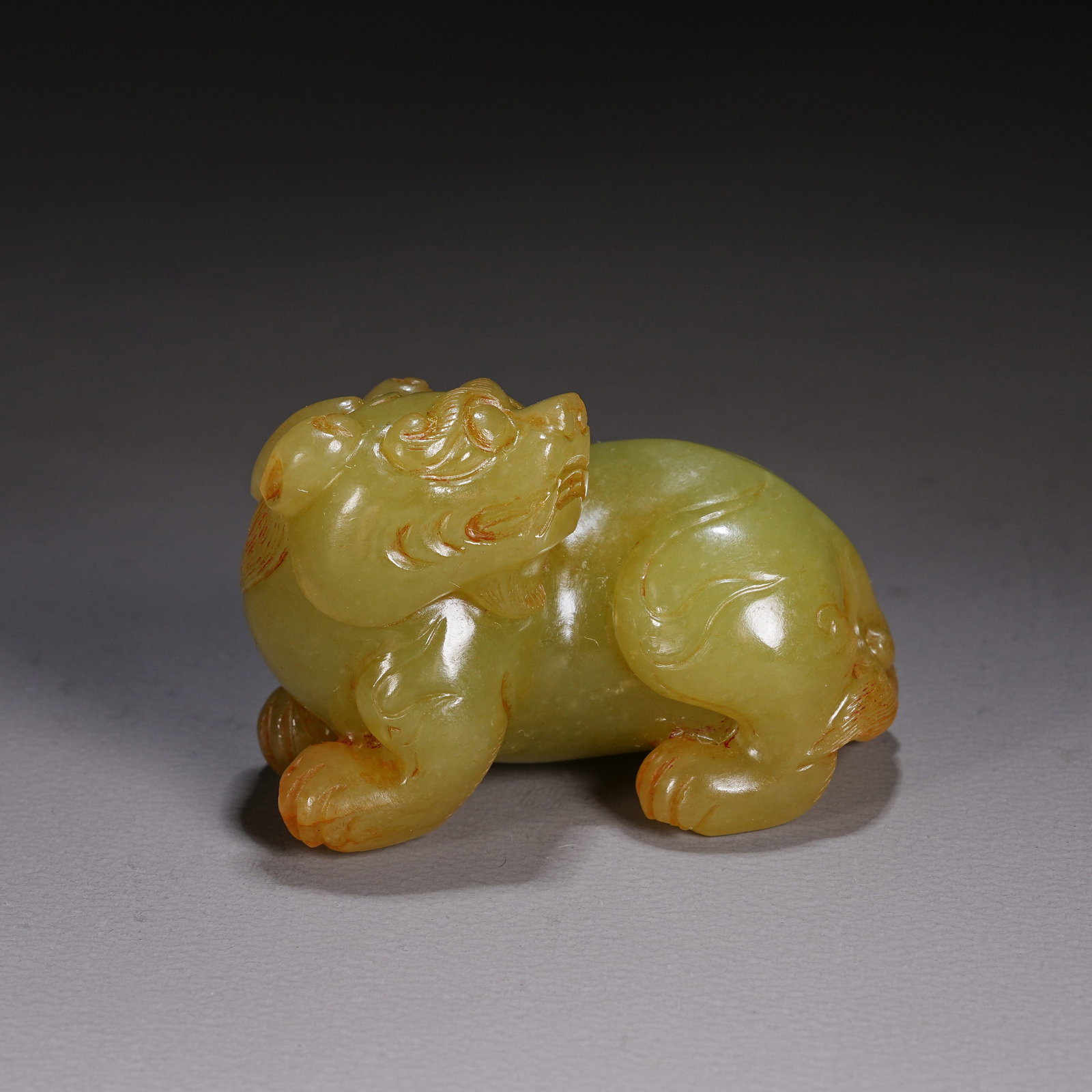 A HETIAN YELLOW JADE AUSPICIOUS BEAST ORNAMENT (1 of 8)