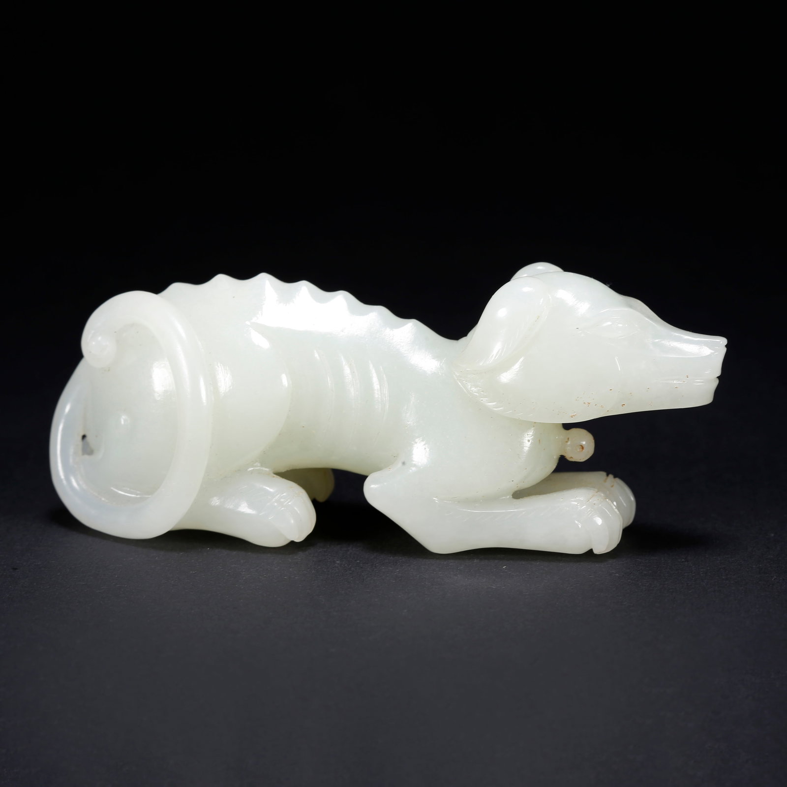 A HETIAN JADE DOG-SHAPED FIGURINE: Hetian Jade Dog-Shaped Figurine