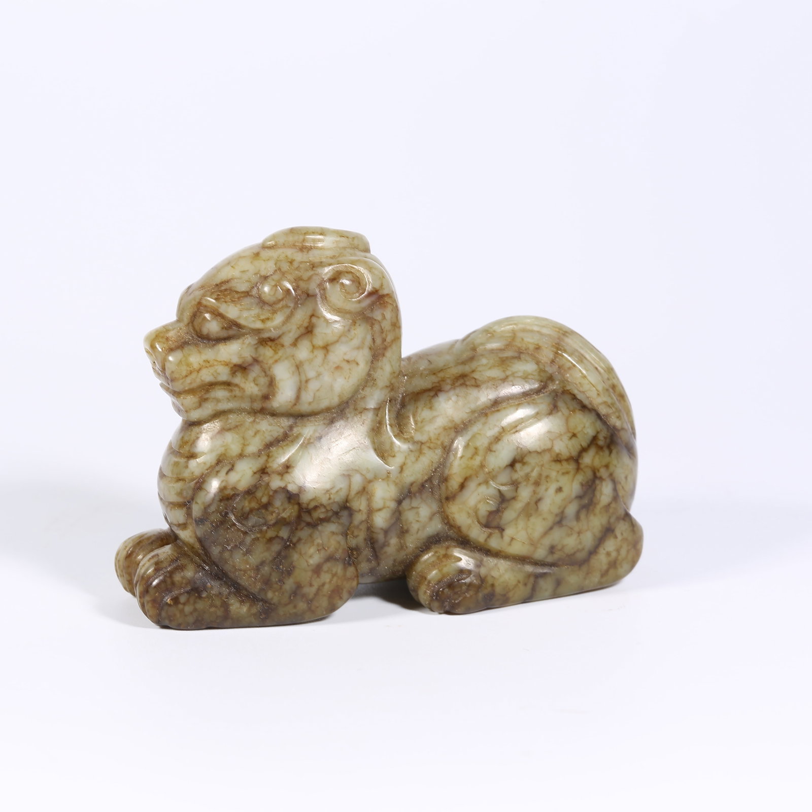 A HETIAN JADE AUSPICIOUS BEAST: Hetian Jade Auspicious Beast