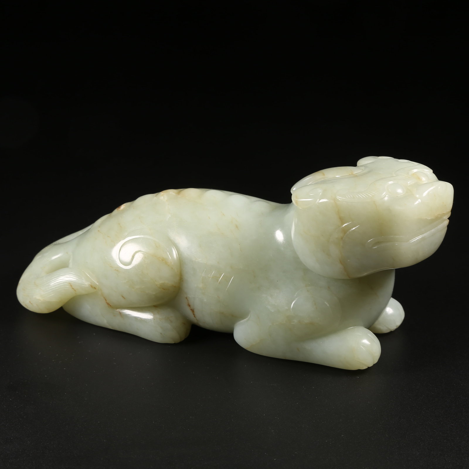 A HETIAN JADE AUSPICIOUS BEAST ORNAMENT (1 of 8)