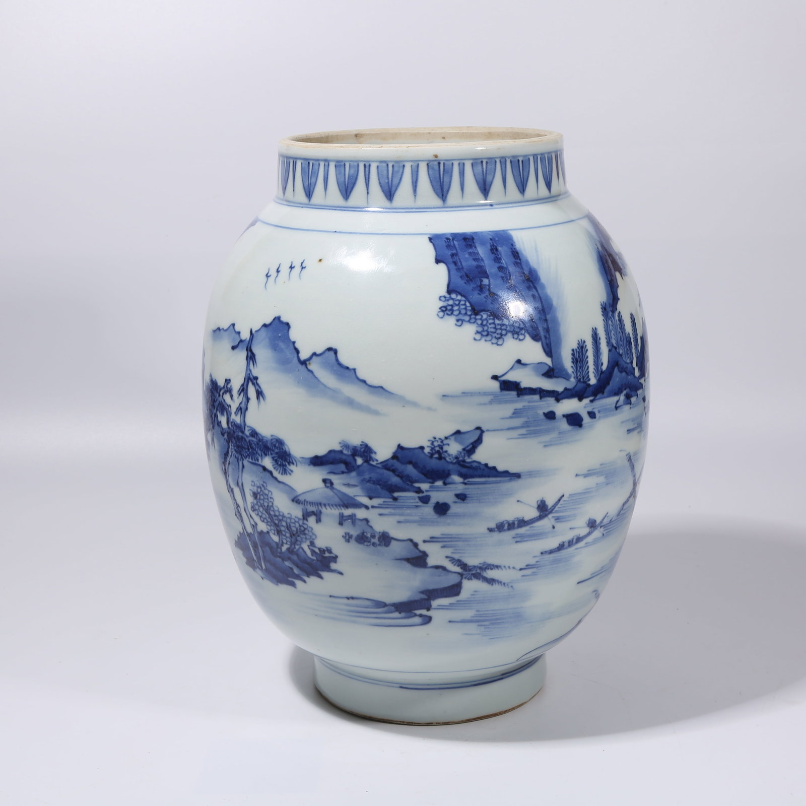 A BLUE-AND-WHITE LANDSCAPE LOTUS-SEED JAR: Blue-and-White Landscape Lotus-Seed Jar