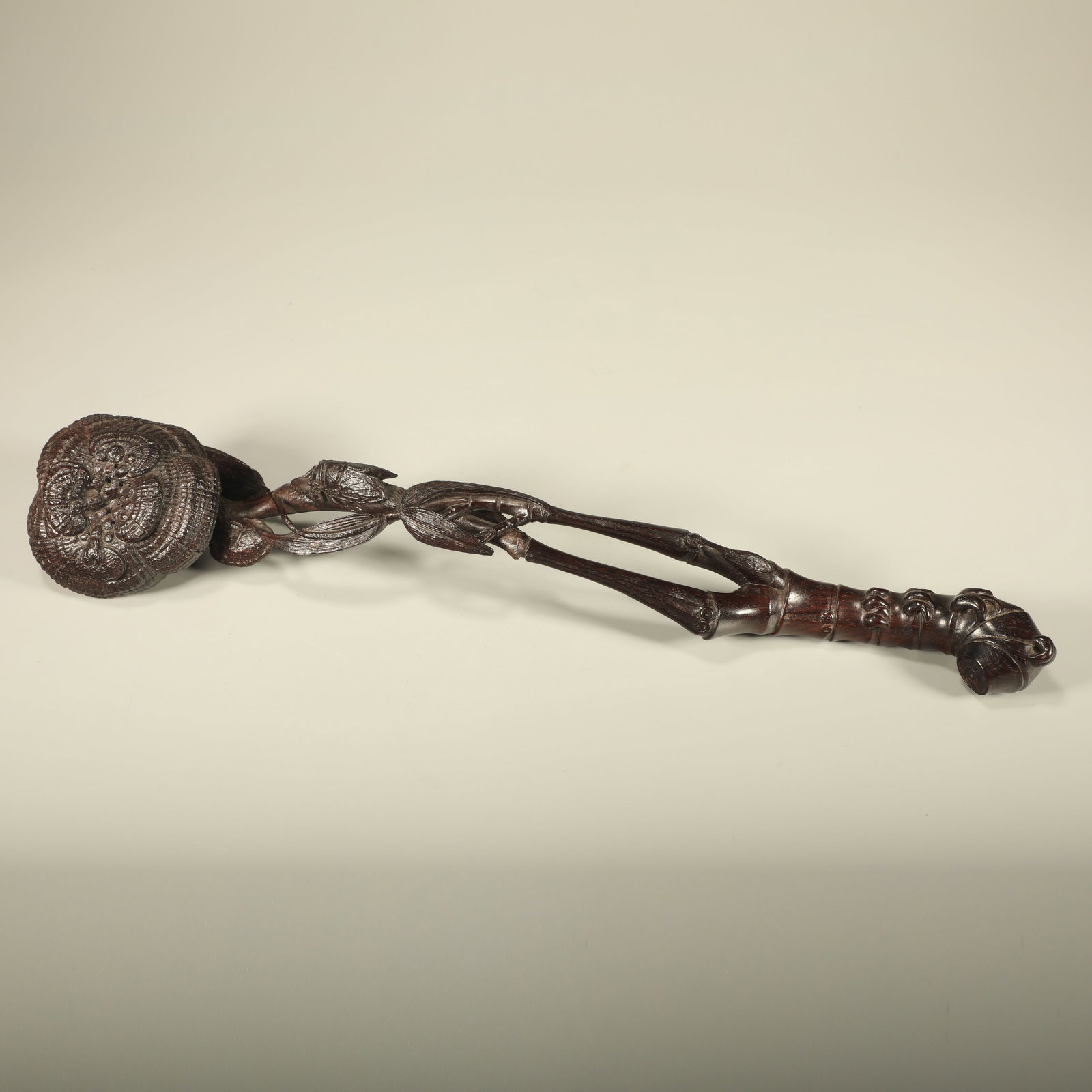 A RED SANDALWOOD CARVED GANODERMA LUCIDUM RUYI SCEPTER: Red Sandalwood Carved Ganoderma Lucidum Ruyi Scepter