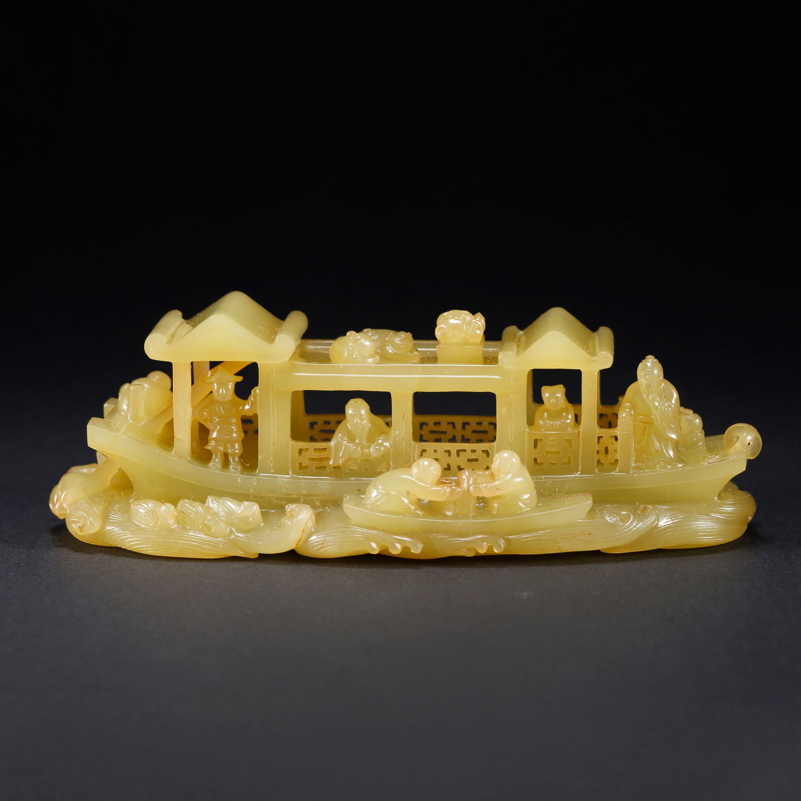 A HETIAN YELLOW JADE BOAT-SHAPED FIGURINE: Hetian Yellow Jade Boat-Shaped Figurine