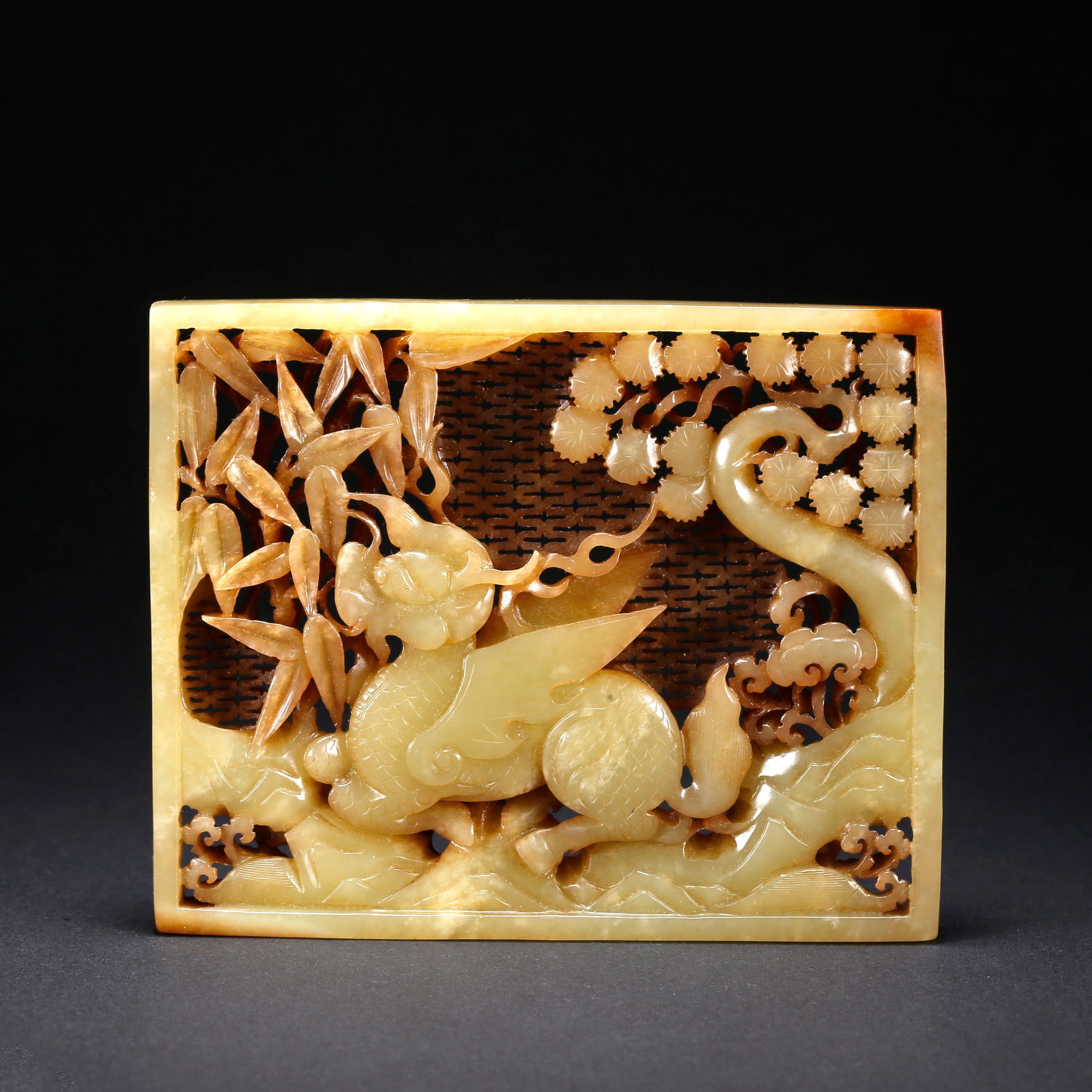 A HETIAN YELLOW JADE AUSPICIOUS BEAST MOTIF PENDANT: Hetian Yellow Jade Auspicious Beast Motif Pendant