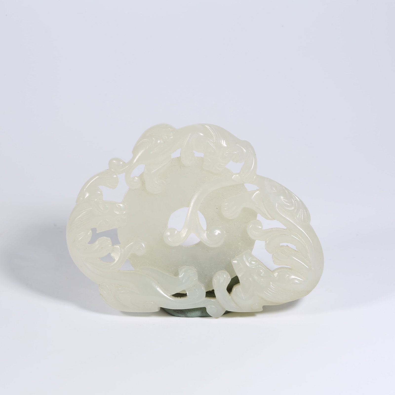 A HETIAN JADE BI DISK WITH CHI-DRAGON MOTIF (1 of 7)