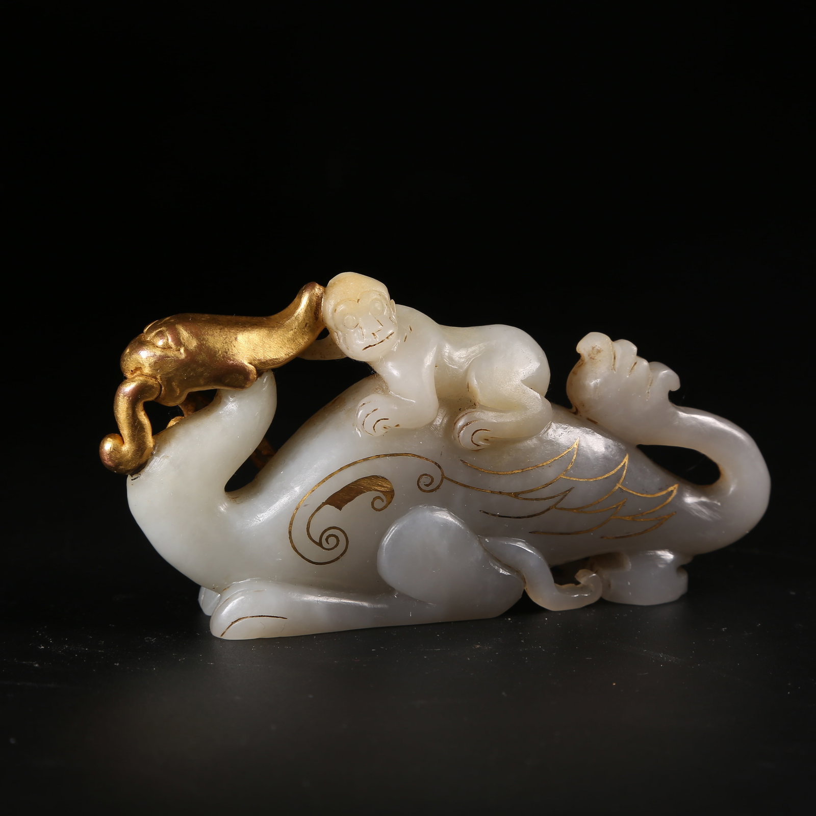 A ANCIENT JADE BEAST FIGURINE WITH GOLD AND BRONZE GILT INLAY: Ancient Jade Beast Figurine with Gold and Bronze Gilt Inlay