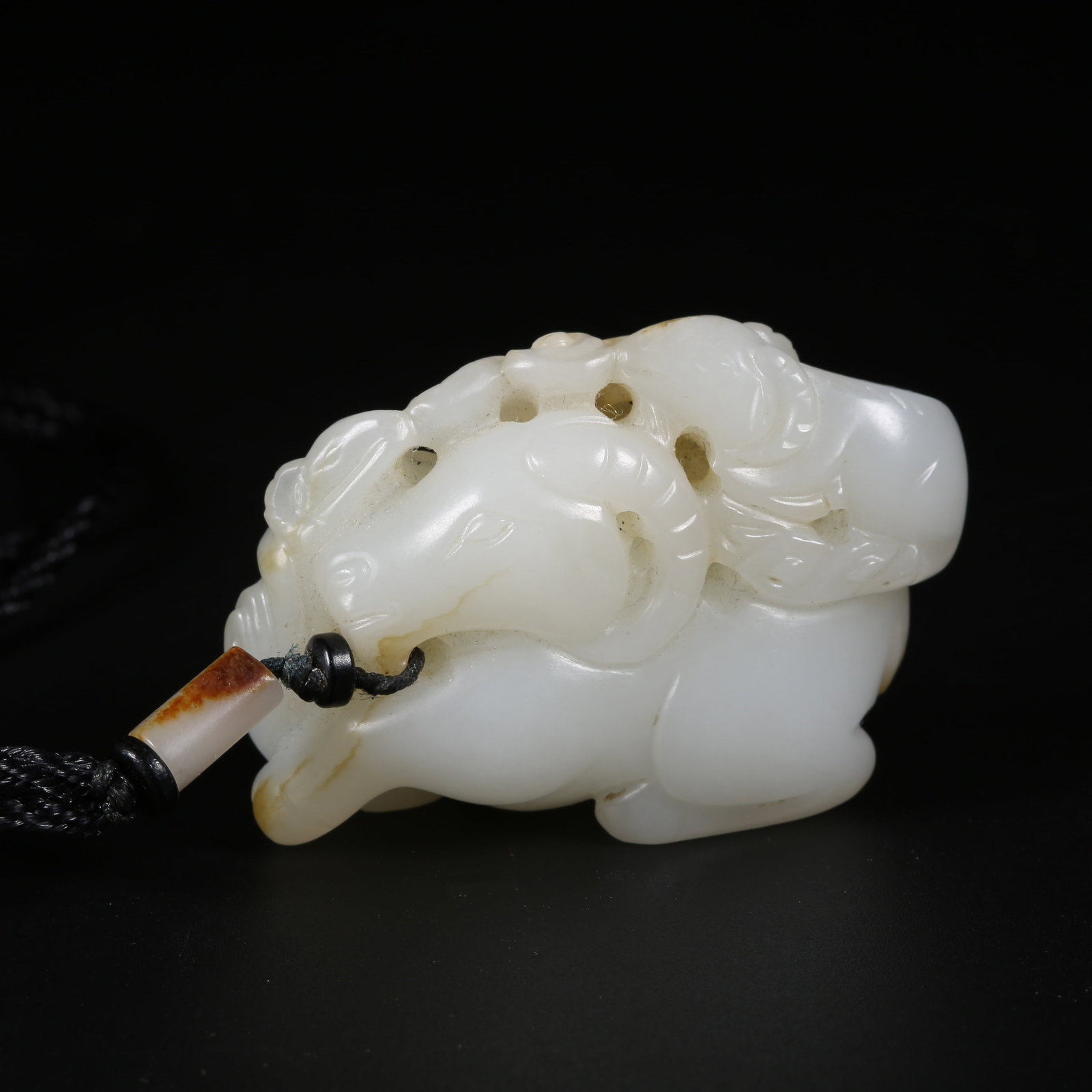 A HETIAN WHITE JADE PENDANT WITH "THREE GOATS BRINGING GOOD FORTUNE" MOTIF: Hetian White Jade Pendant with "Three Goats Bringing Good Fortune" Motif