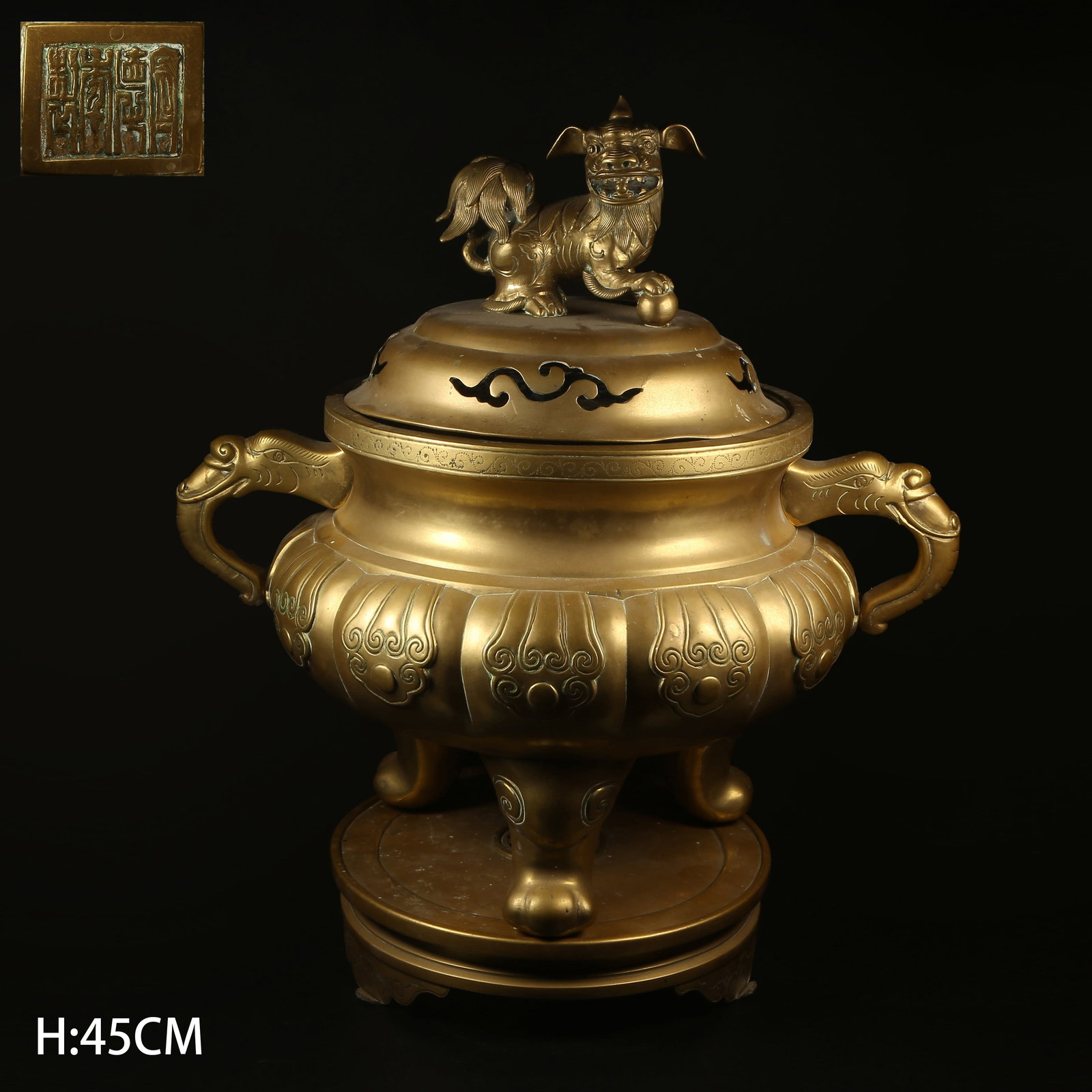 A BRONZE TRIPOD INCENSE BURNER WITH LION FINIAL AND ELEPHANT-SHAPE HANDLES: Bronze Tripod Incense Burner with Lion Finial and Elephant-Shape Handles