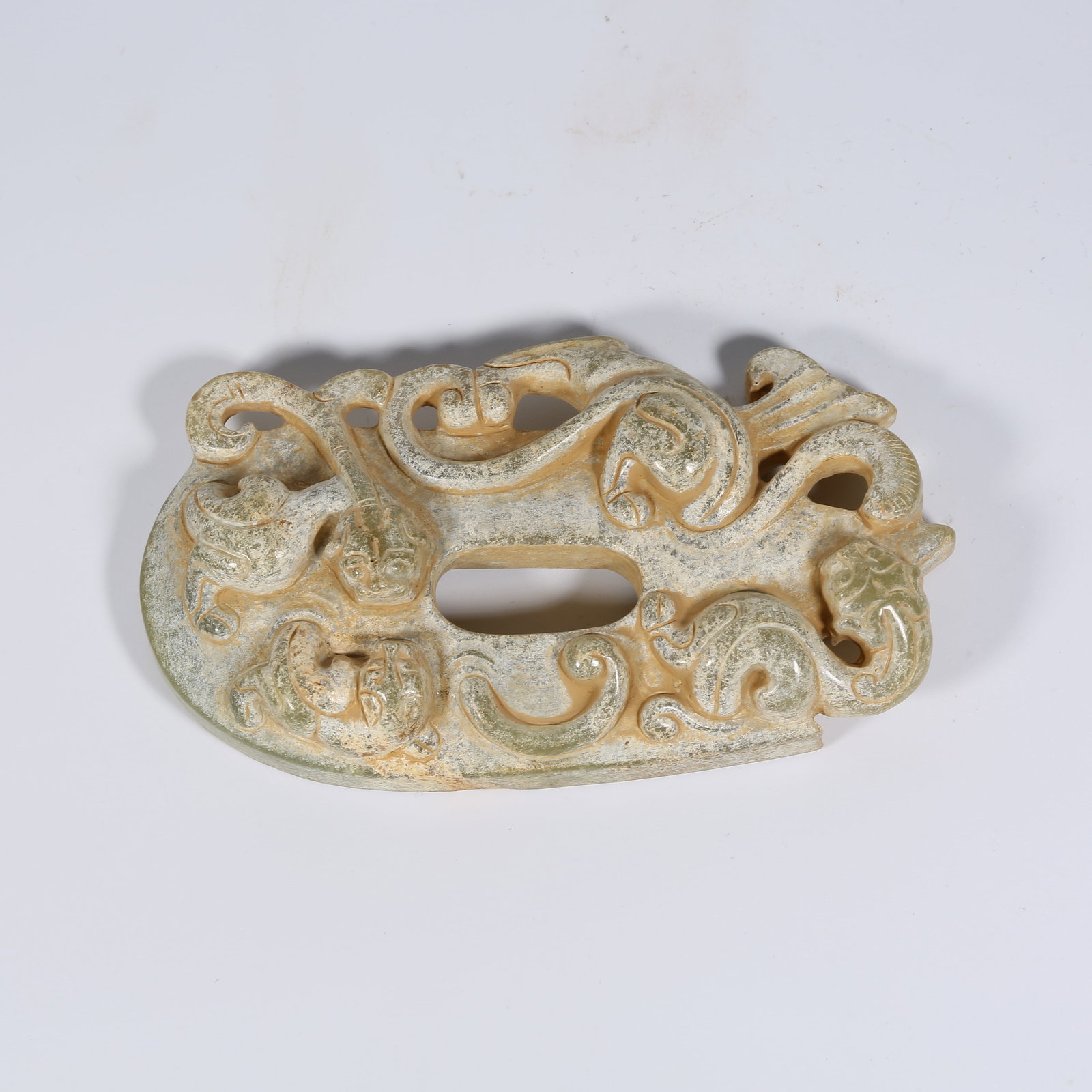 A ANCIENT JADE CHICKEN-HEART PENDANT WITH CHI-DRAGON MOTIF: Ancient Jade Chicken-Heart Pendant with Chi-Dragon Motif