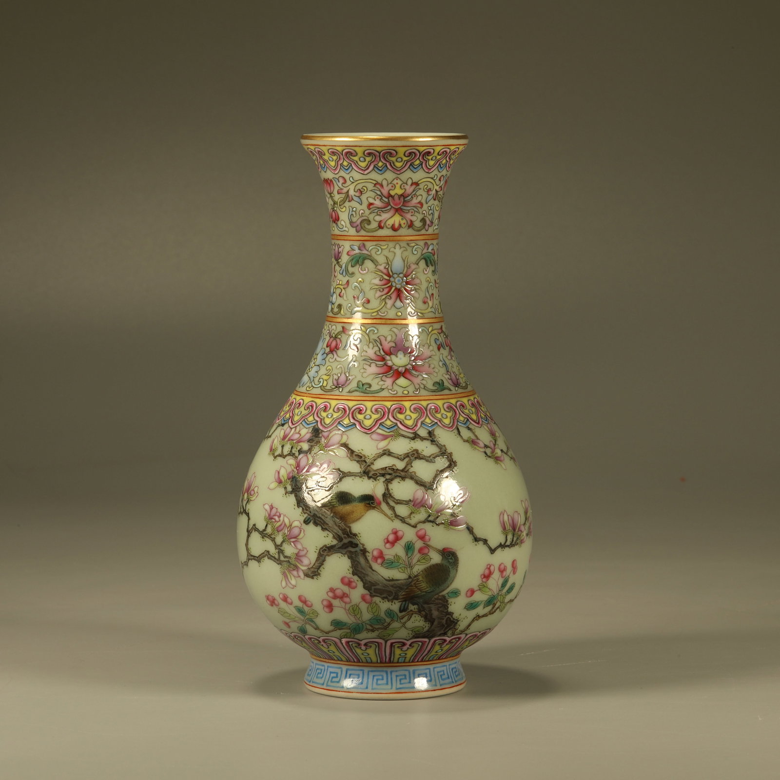 A CELADON GLAZED FAMILLE ROSE VASE WITH MAGPIE ON PLUM BLOSSOM MOTIF: Celadon Glazed Famille Rose Vase with Magpie on Plum Blossom Motif