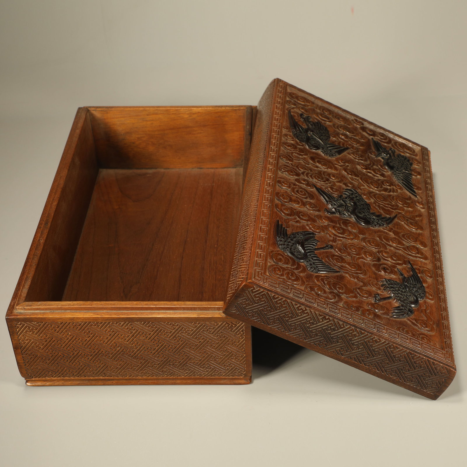 A GOLDEN NANMU BOX CARVED WITH CLOUD AND CRANE PATTERN INLAID WITH RED SANDALWOOD (1 of 7)