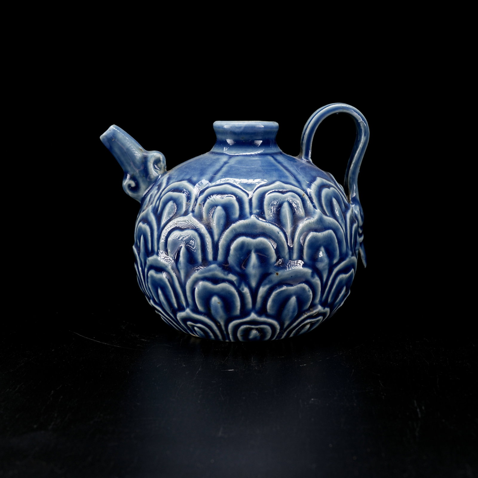 A SKY-BLUE GLAZED EWER WITH LOTUS PETAL DESIGN: Sky-Blue Glazed Ewer with Lotus Petal Design