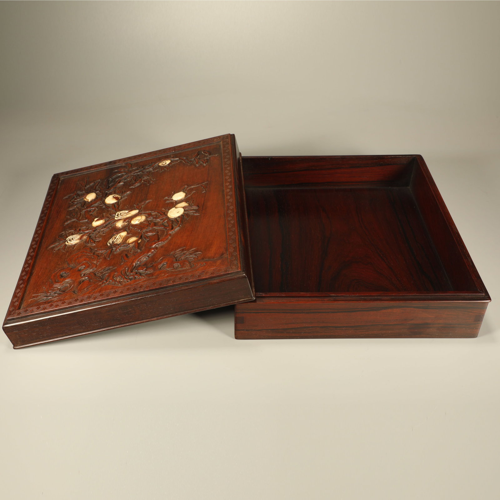 A HUANGHUALI COVERED BOX CARVED WITH THREE ABUNDANCES MOTIF (1 of 7)