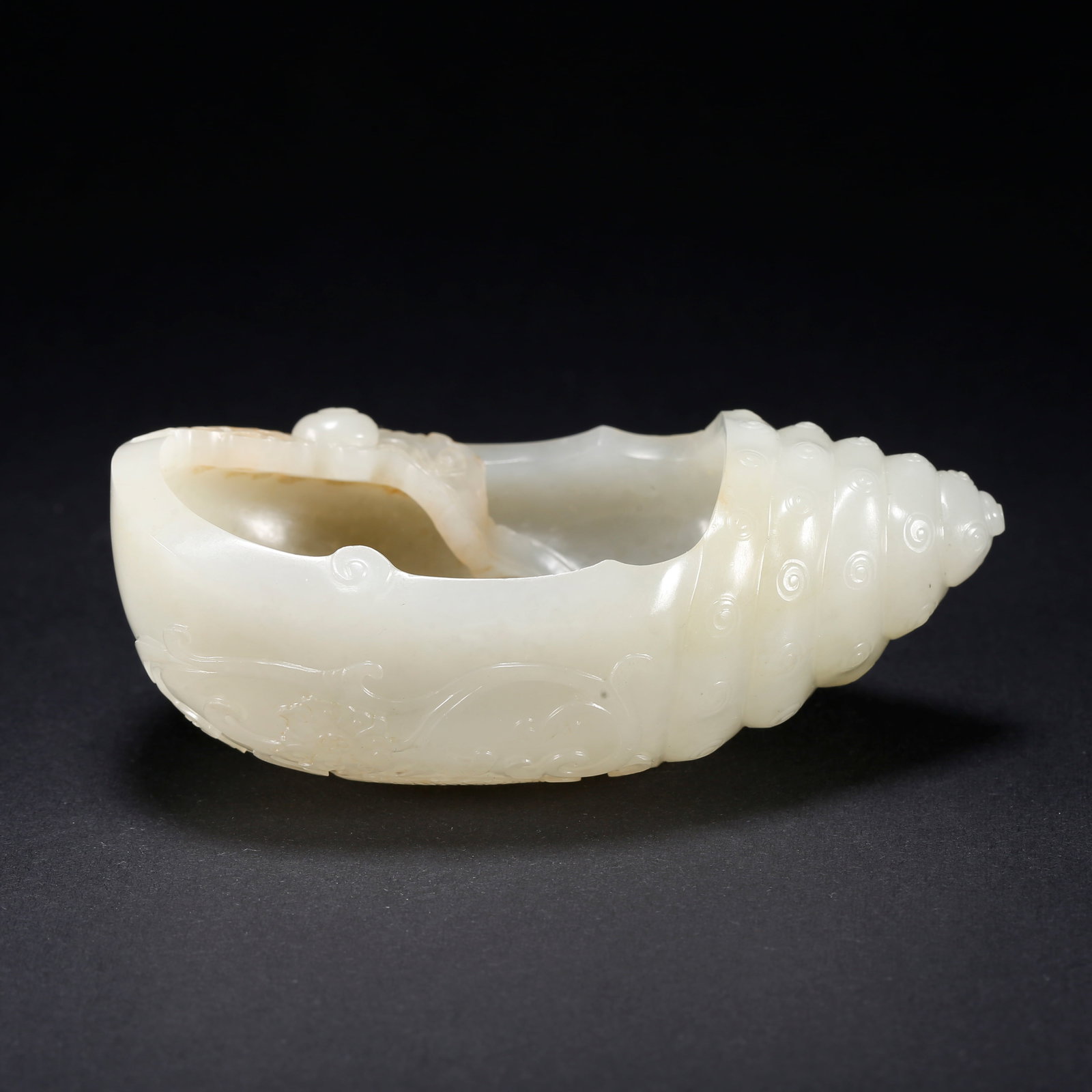 A HETIAN JADE CONCH-SHAPED WASHER (1 of 10)