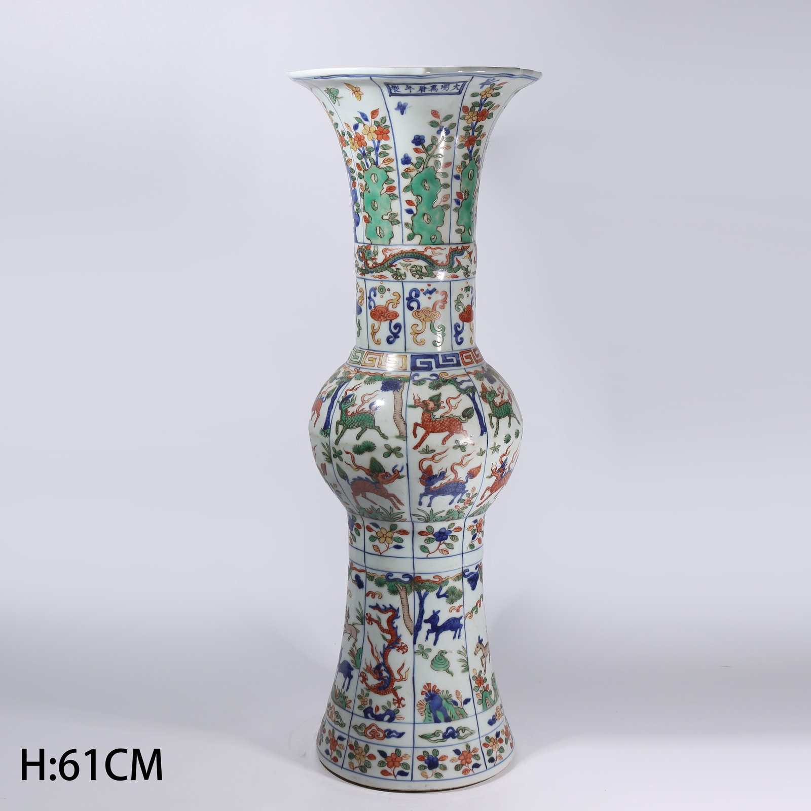 A BLUE-AND-WHITE WUCAI AUSPICIOUS BEAST FLOWER GU: Blue-and-White Wucai Auspicious Beast Flower Gu