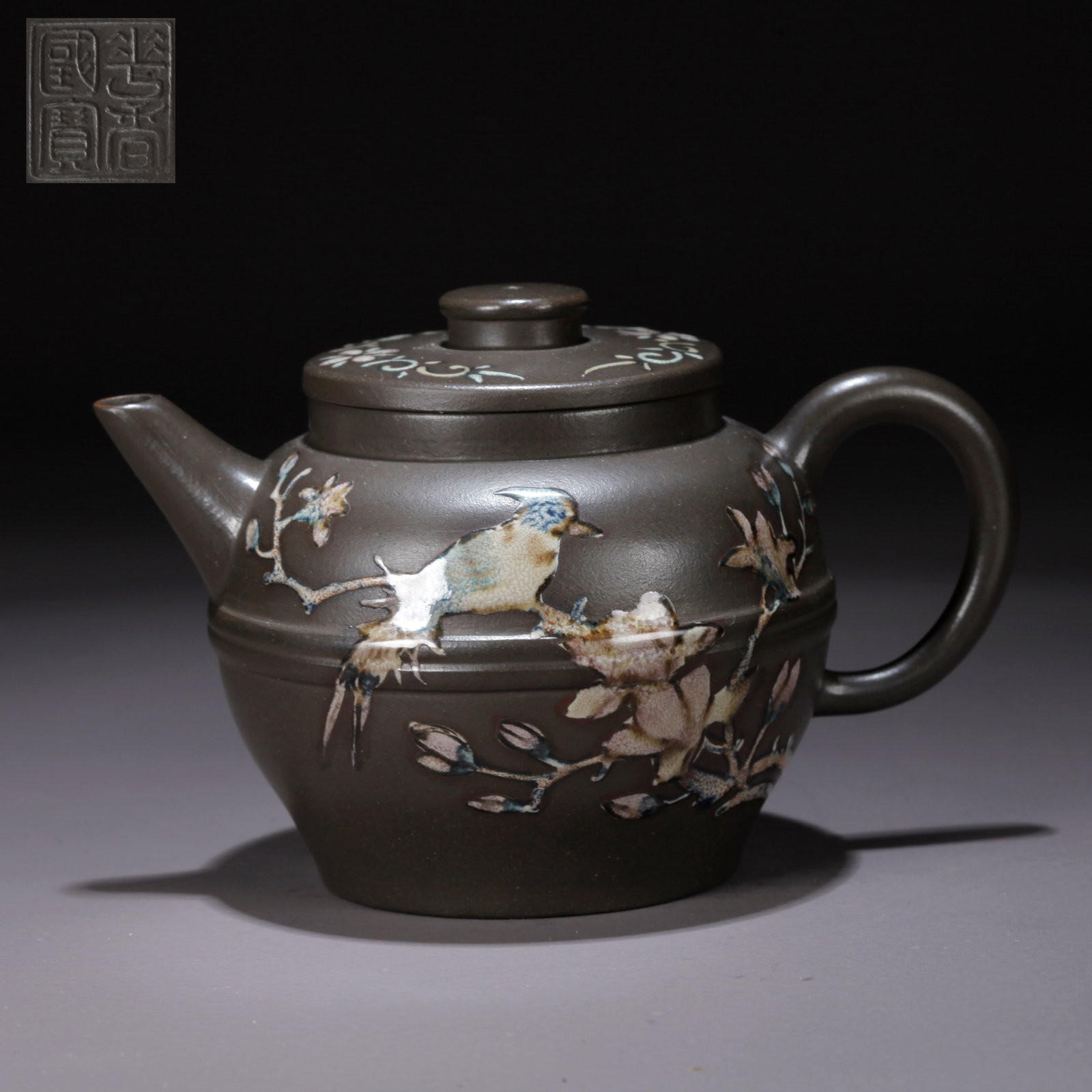 A PURPLE CLAY (ZISHA) FLORAL-AND-BIRD TEAPOT: Purple Clay (Zisha) Floral-and-Bird Teapot