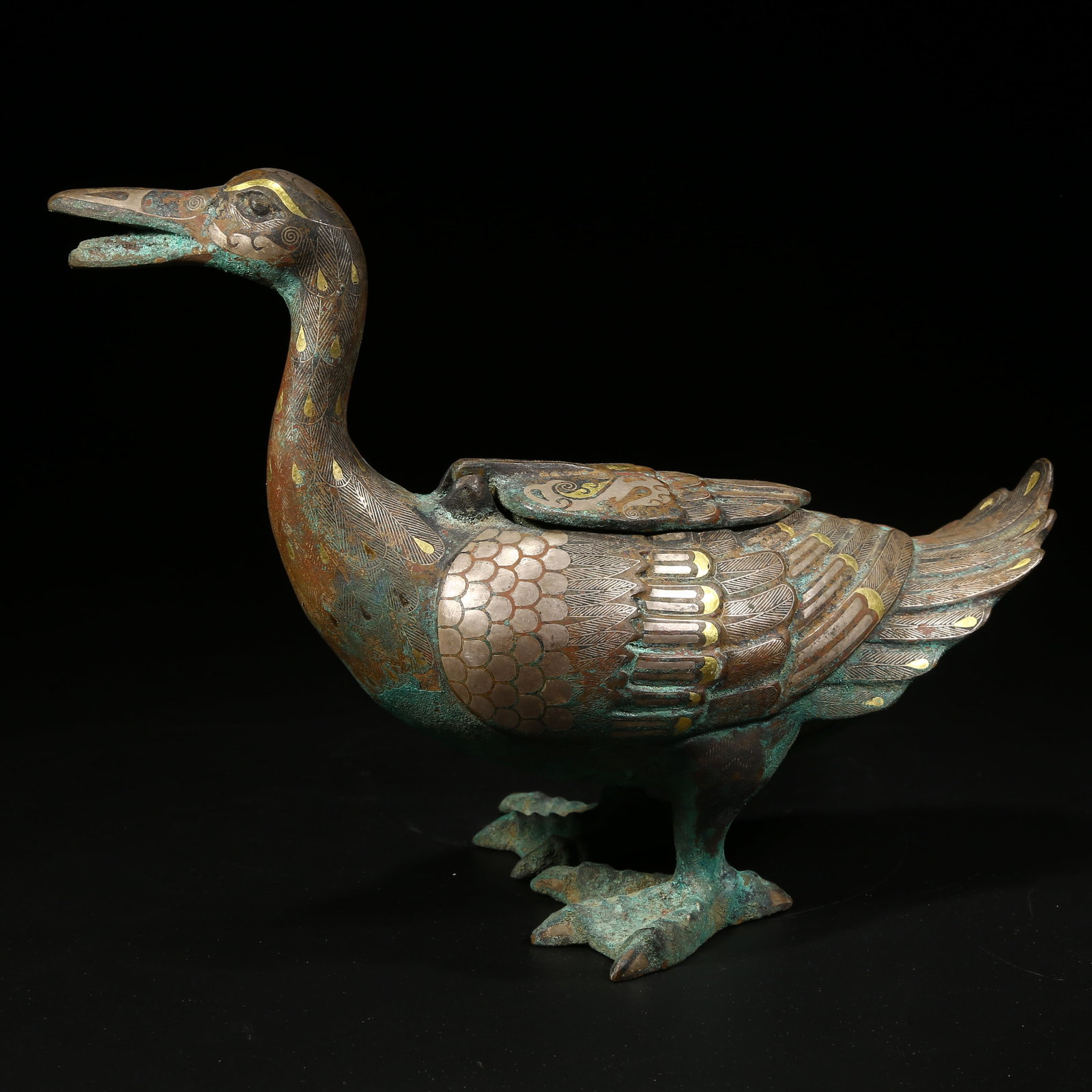 A BRONZE INCENSE BURNER WITH TREASURE DUCK DESIGN, INLAID WITH GOLD AND SILVER: Bronze incense burner with treasure duck design, inlaid with gold and silver