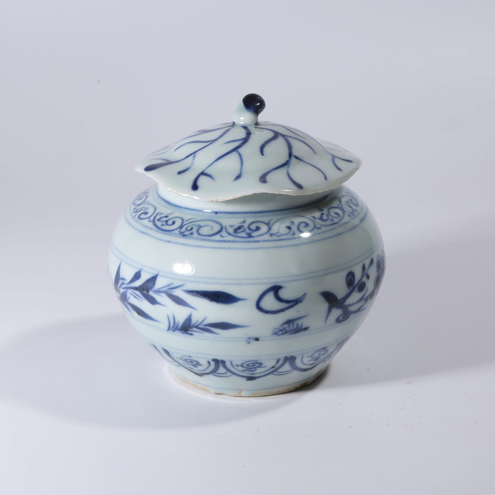 A BLUE-AND-WHITE LIDDED JAR WITH FLORAL PATTERN: Blue-and-White Lidded Jar with Floral Pattern