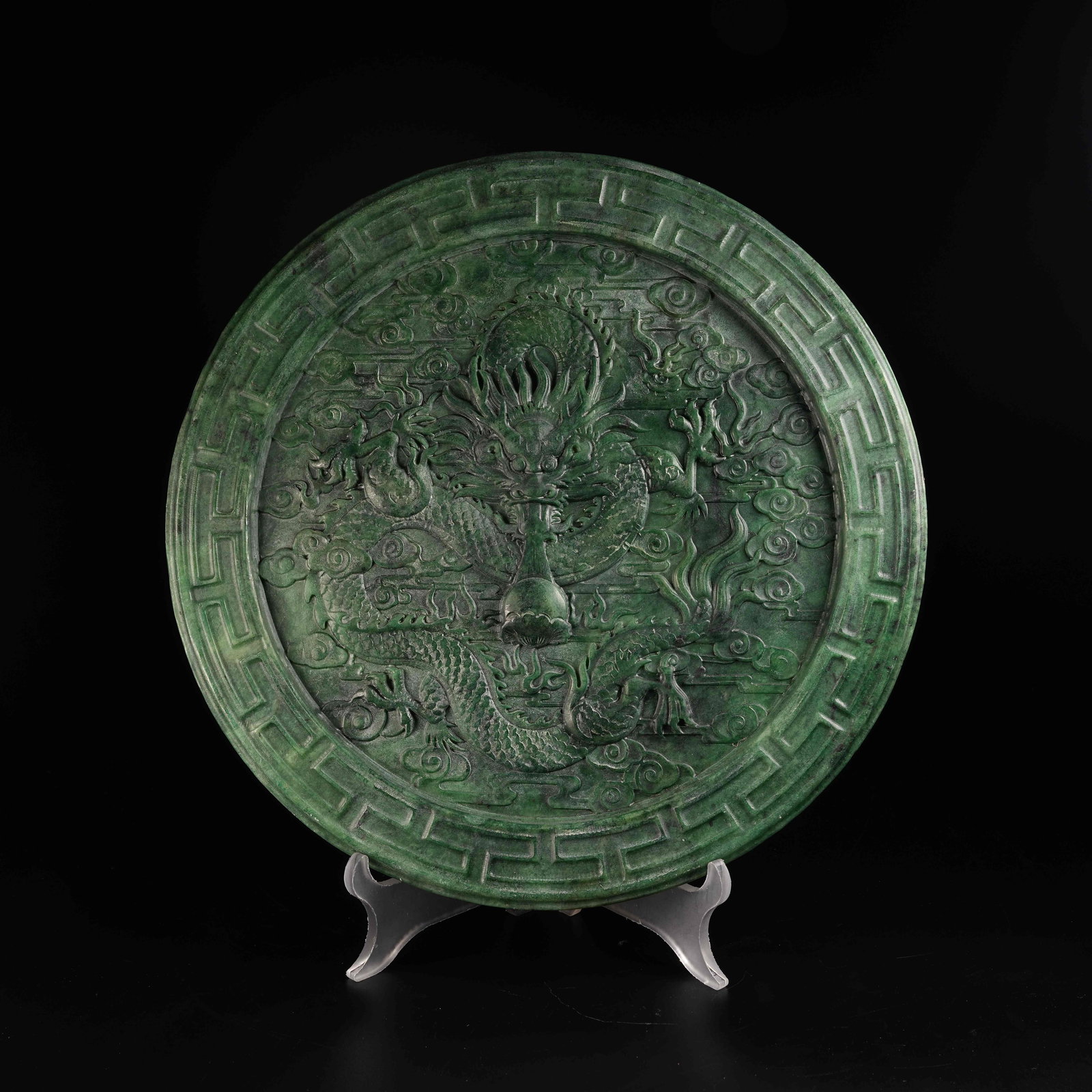 A HETIAN JASPER MIRROR WITH CLOUD-AND-DRAGON "DRAGON SPITTING PEARL" MOTIF (1 of 8)