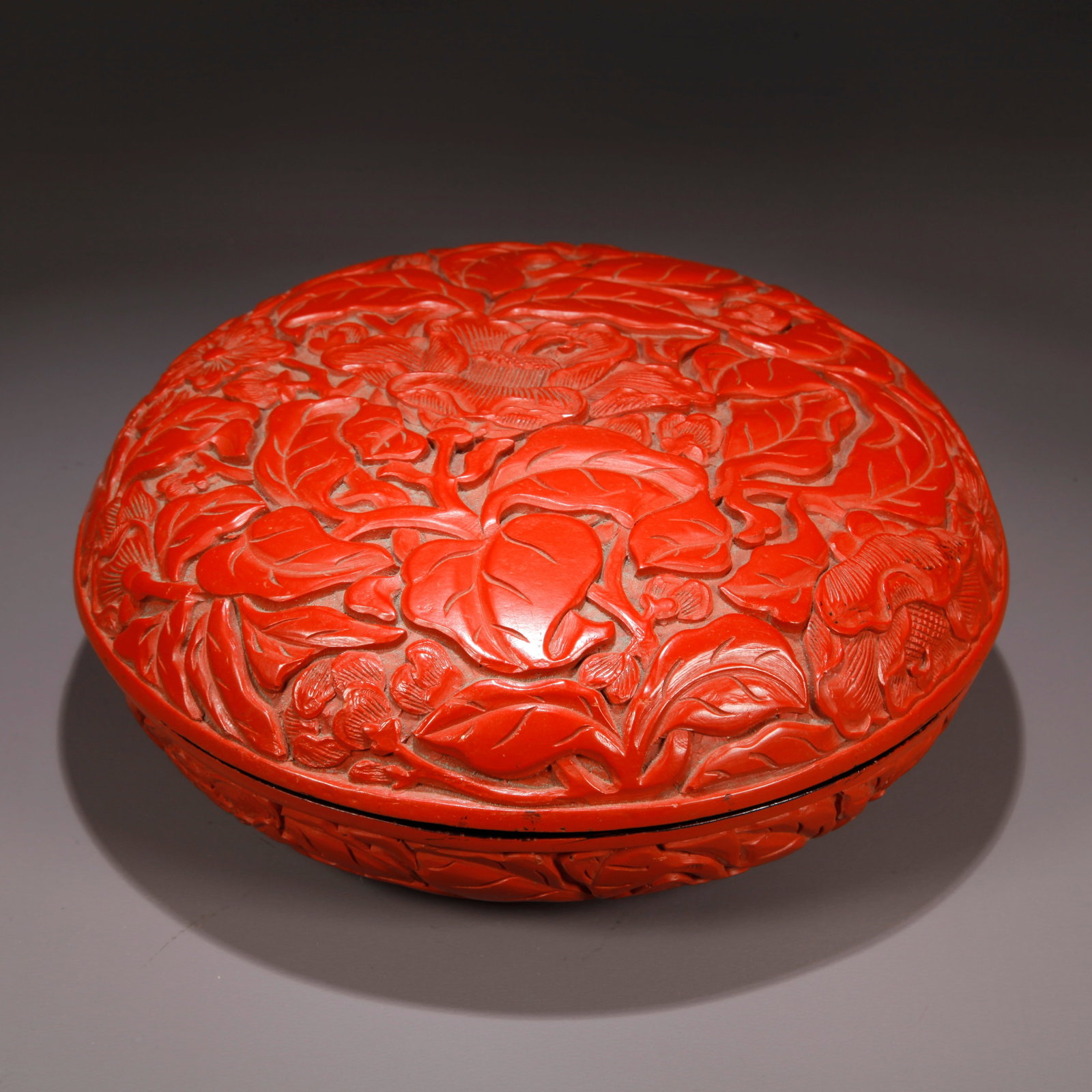 A CARVED RED LACQUER COVERED BOX WITH LOTUS PATTERN (1 of 9)