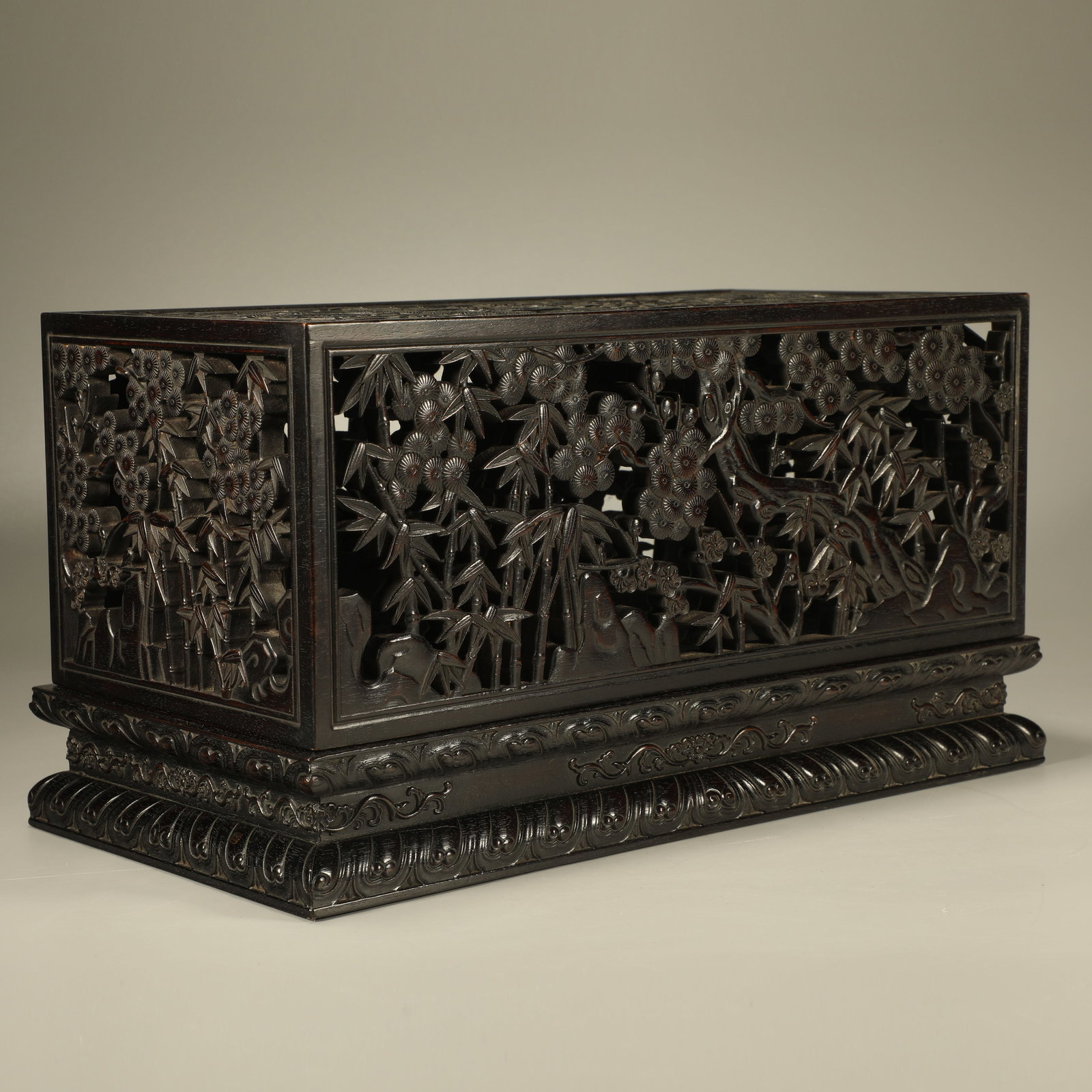 A RED SANDALWOOD OPENWORK COVERED BOX WITH PINE, BAMBOO AND PLUM PATTERN (1 of 7)