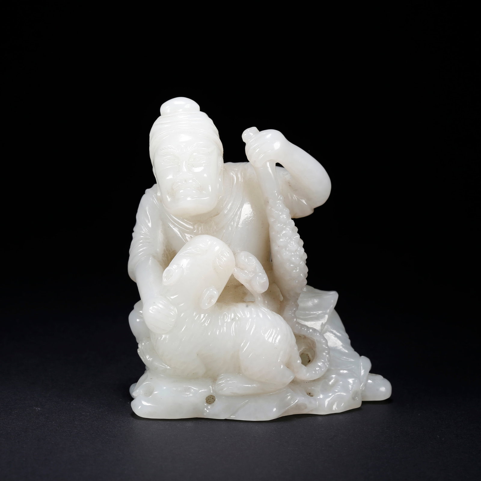 A HETIAN JADE RECLINING TIGER ARHAT SCULPTURE (1 of 9)