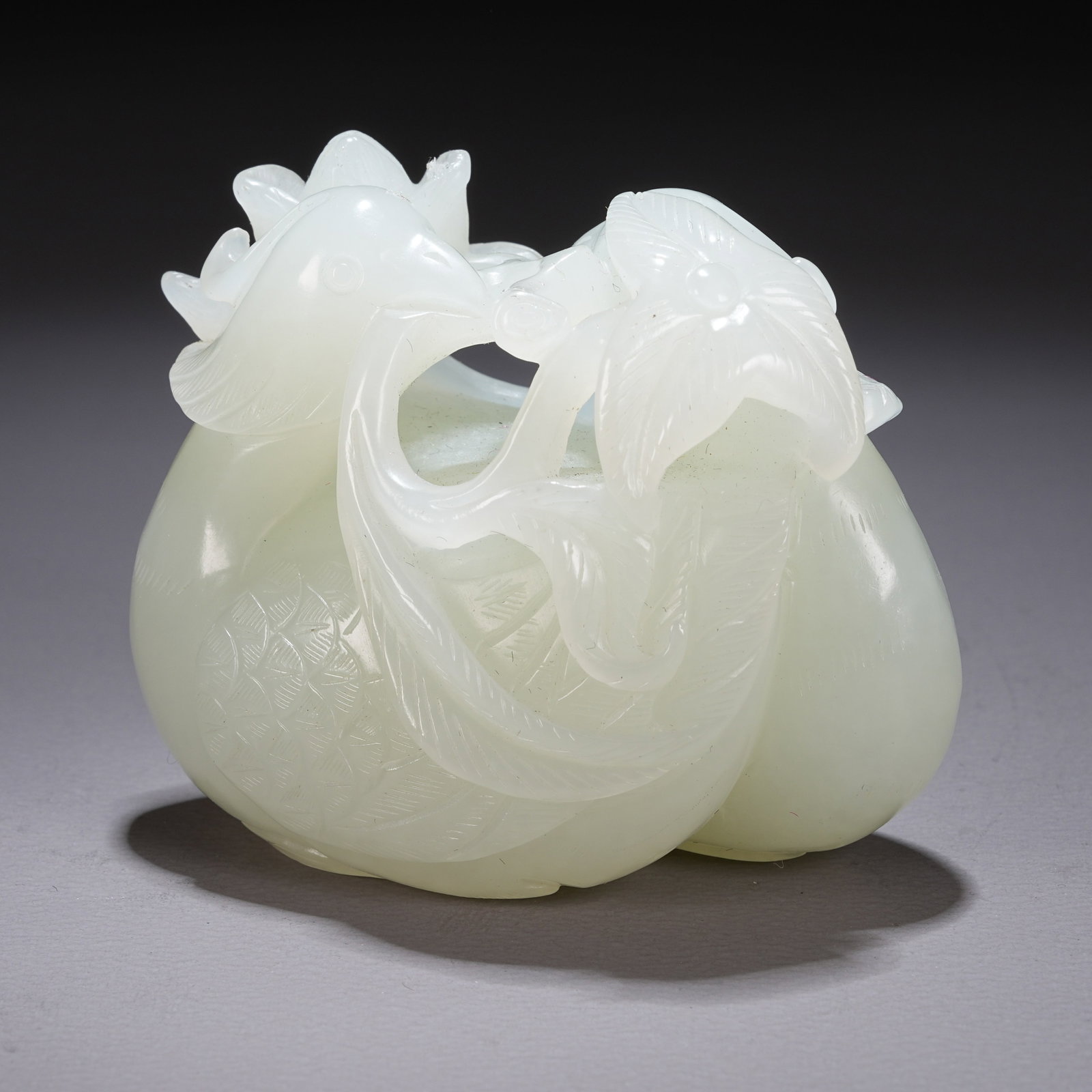 A HETIAN JADE "SWAN PRESENTING LONGEVITY" ORNAMENT (1 of 8)