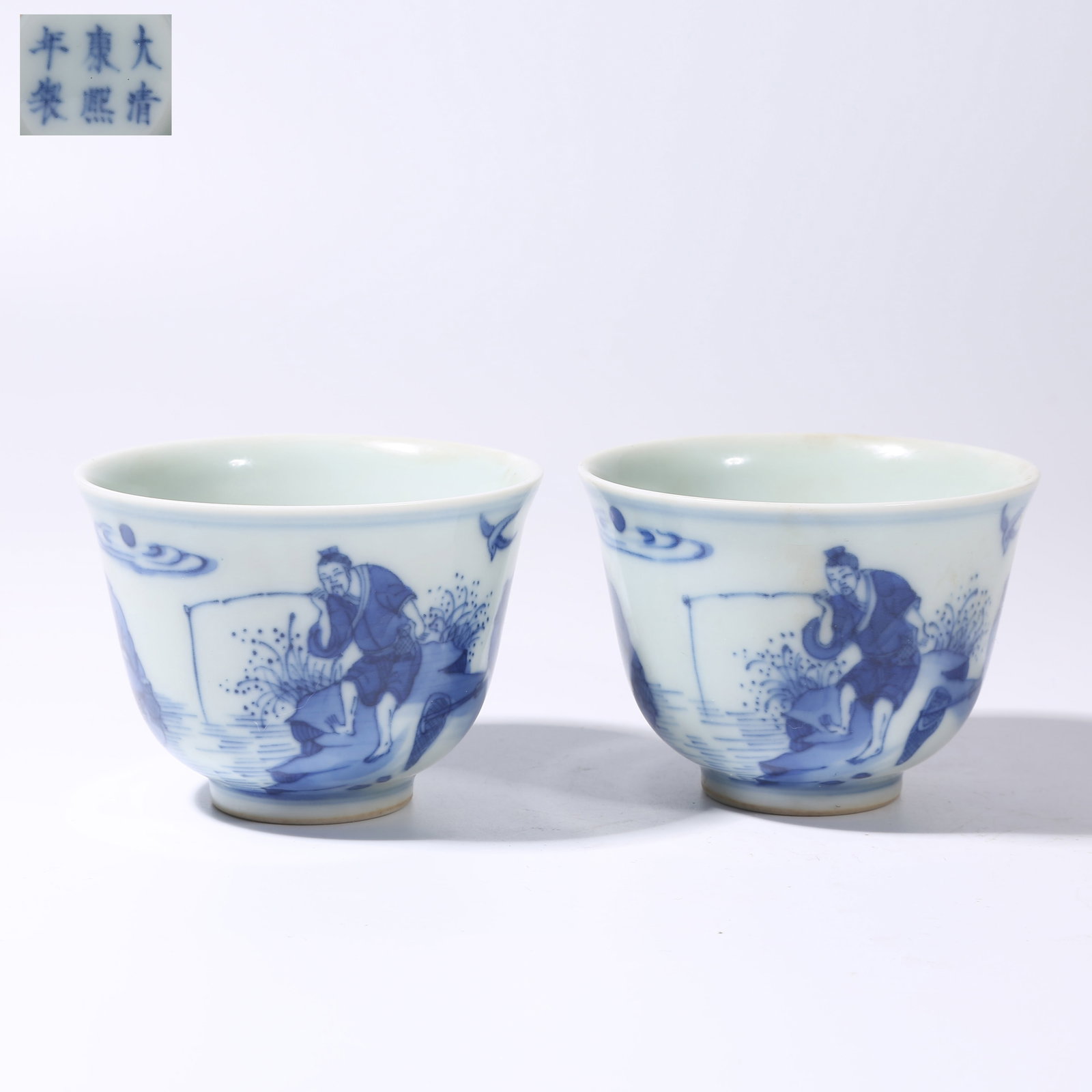 A SET OF BLUE-AND-WHITE FISHING AND LEISURE SCENE CUPS: Set of Blue-and-White Fishing and Leisure Scene Cups