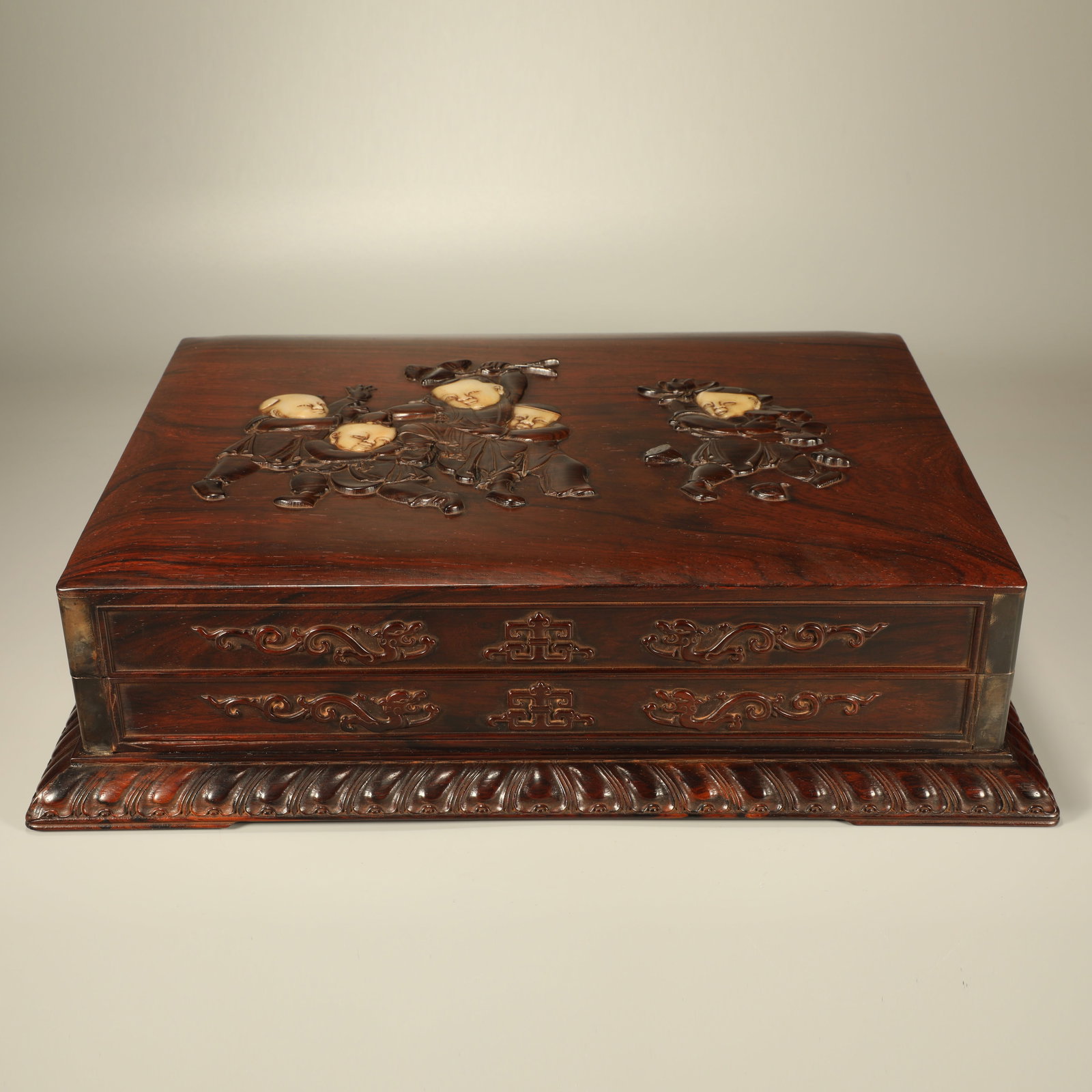 A HUANGHUALI BOX INLAID WITH RED SANDALWOOD CARVING OF CHILDREN AT PLAY FIGURES (1 of 6)