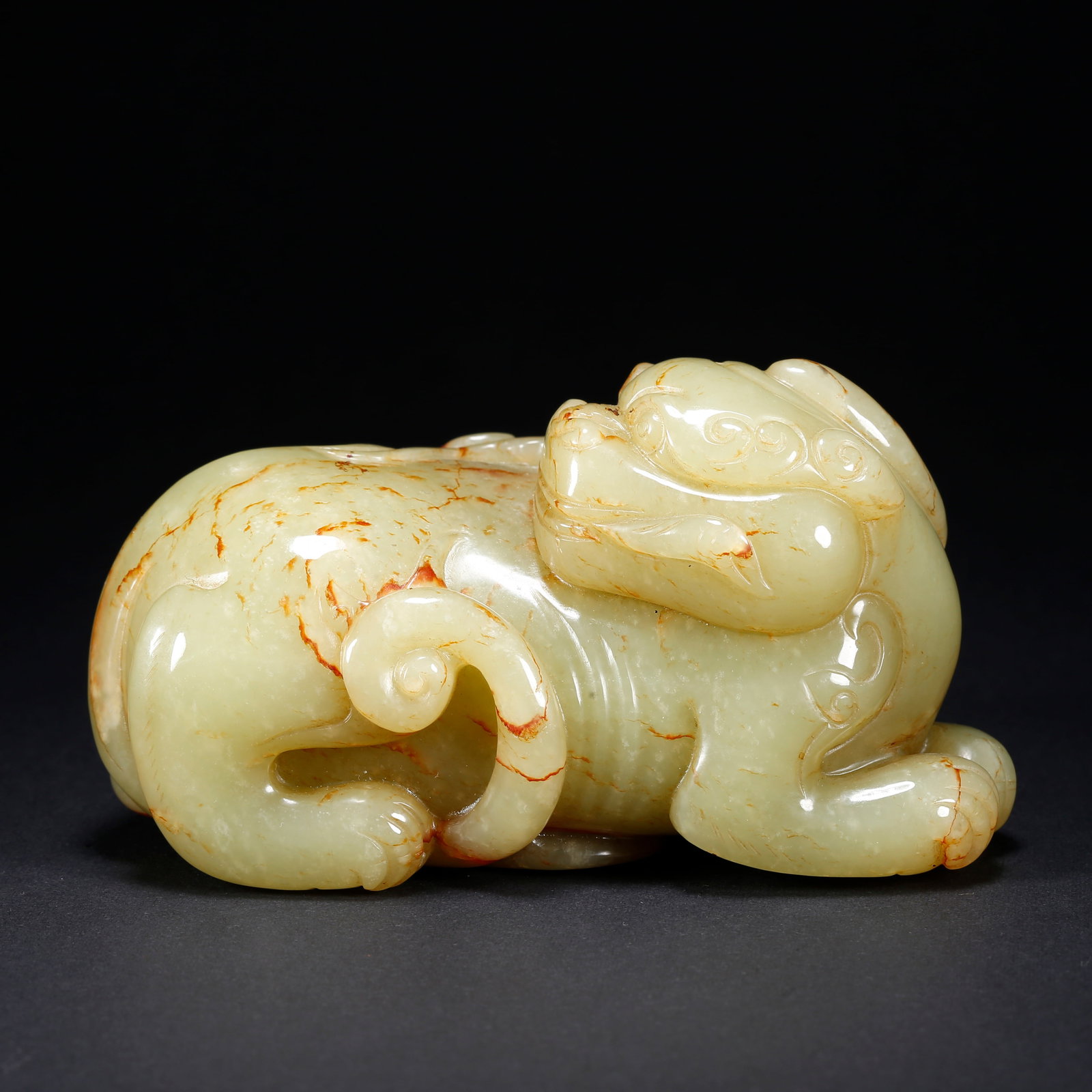 A HETIAN YELLOW JADE TIGER-SHAPED FIGURINE (1 of 9)