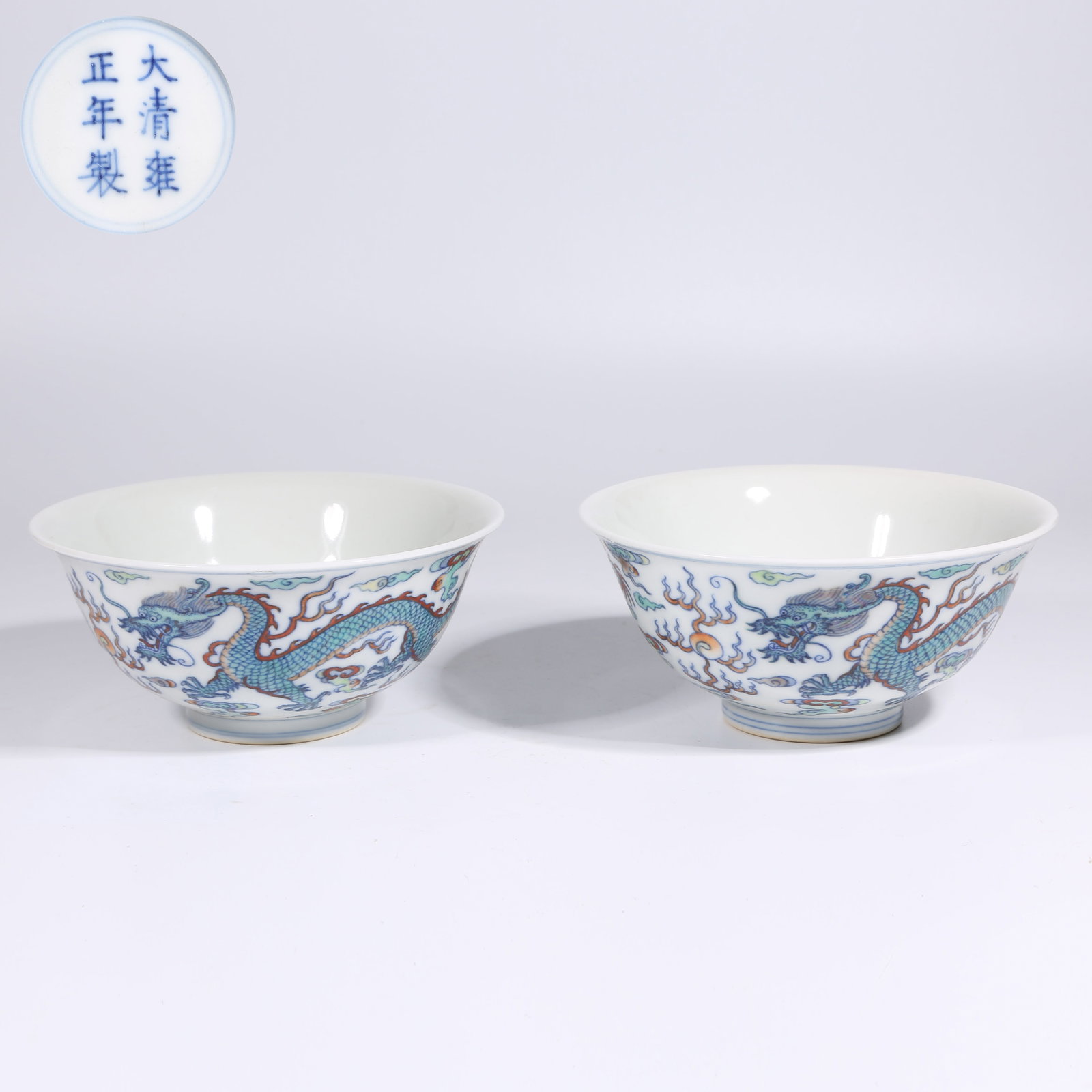 A SET OF DOUCAI CLOUD AND DRAGON CHASING PEARL BOWLS (1 of 9)