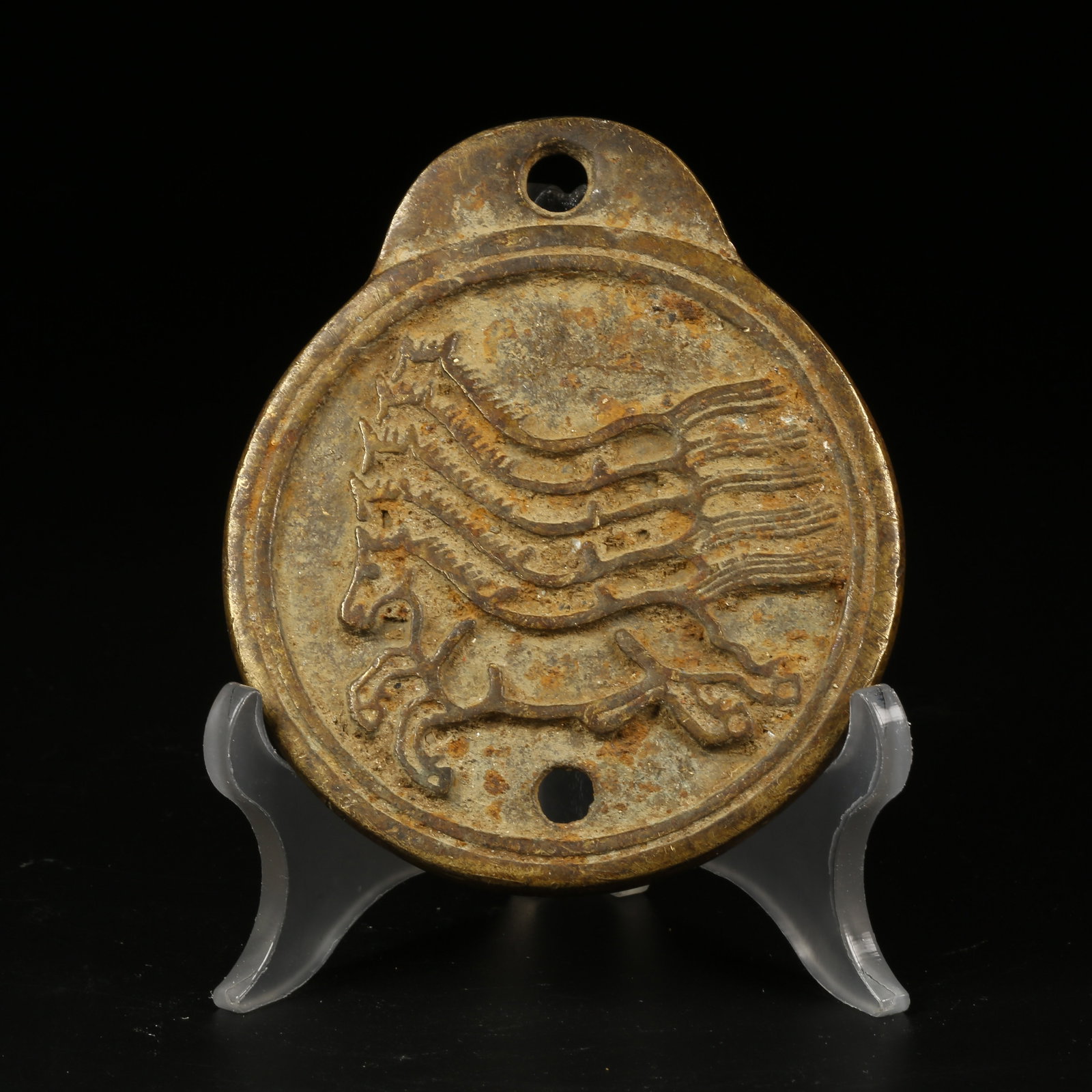 A BRONZE SEAL-PATTERN TOKEN: Bronze Seal-Pattern Token