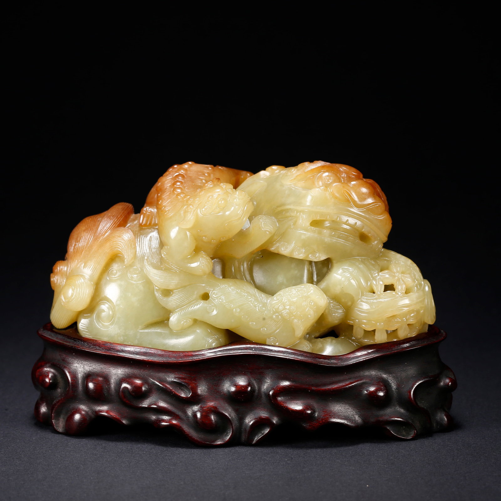 A HETIAN YELLOW JADE LION PLAYING WITH BALL FIGURINE: Hetian Yellow Jade Lion Playing with Ball Figurine