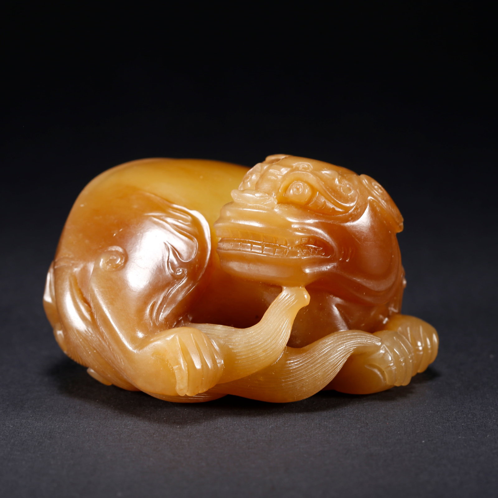 A HETIAN YELLOW JADE TIGER-SHAPED FIGURINE (1 of 9)