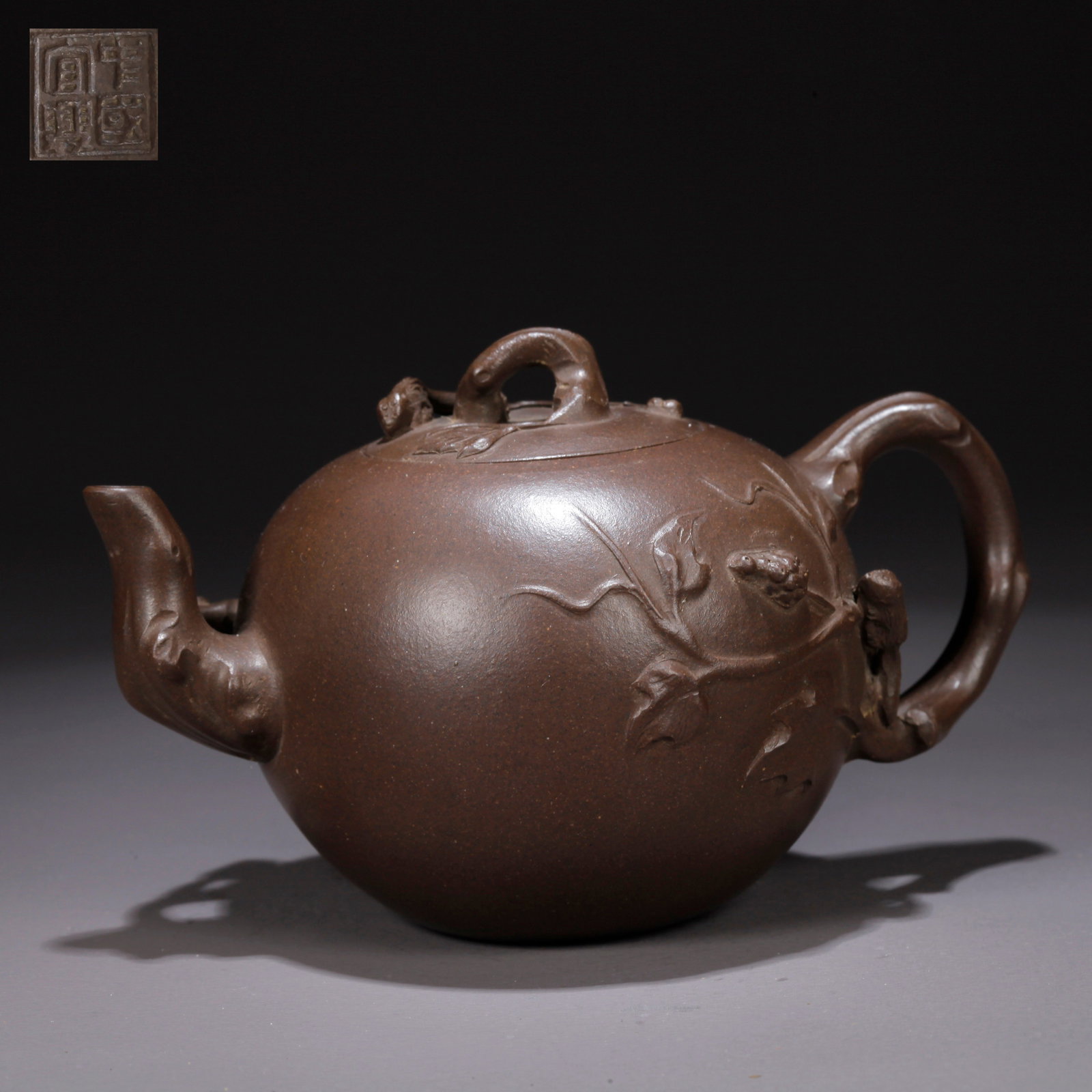 A PURPLE CLAY (ZISHA) TEAPOT WITH SQUIRREL-AND-GRAPES MOTIF (1 of 9)