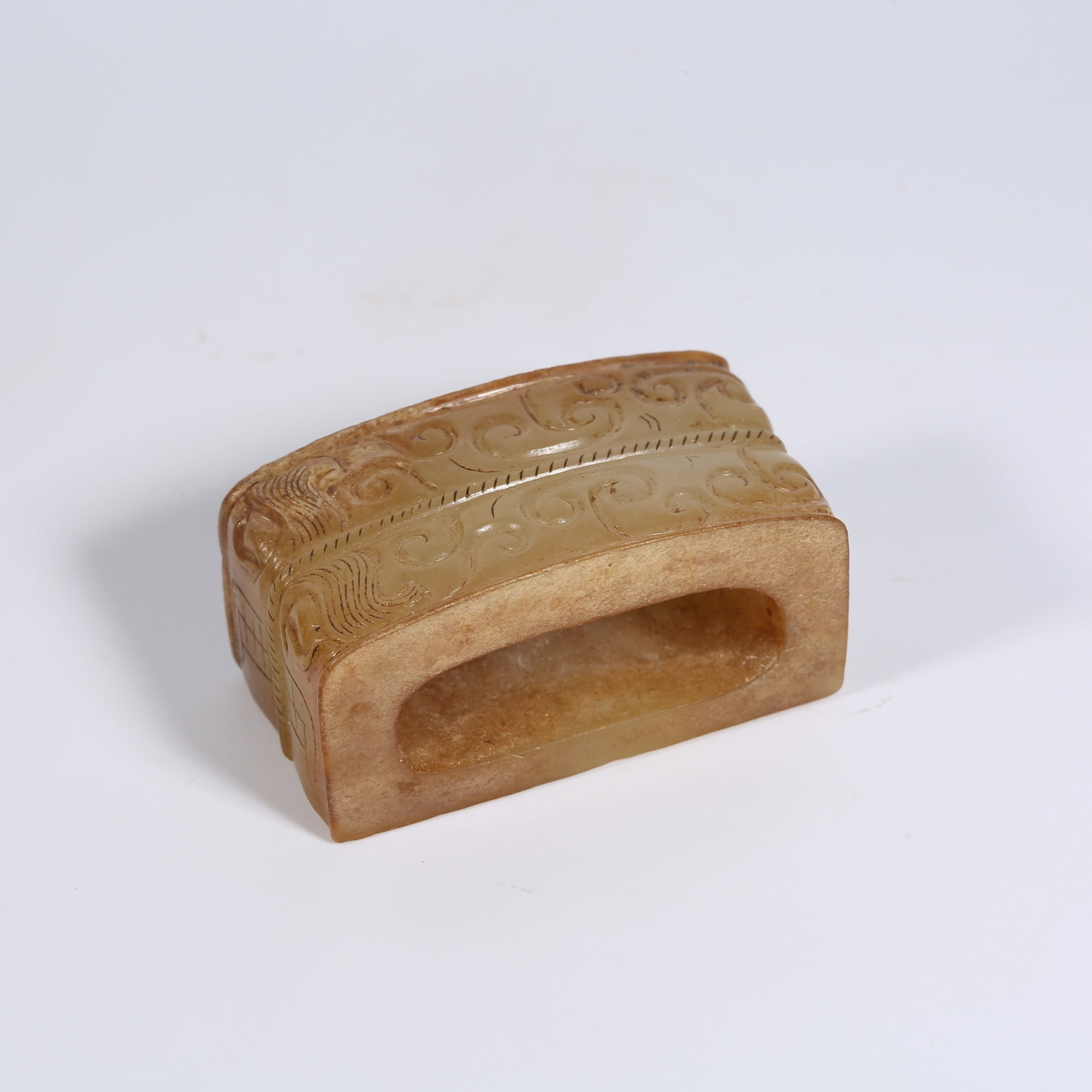 A ANCIENT JADE SWORD FITTING WITH INTERLINKED CLOUD MOTIF (1 of 9)
