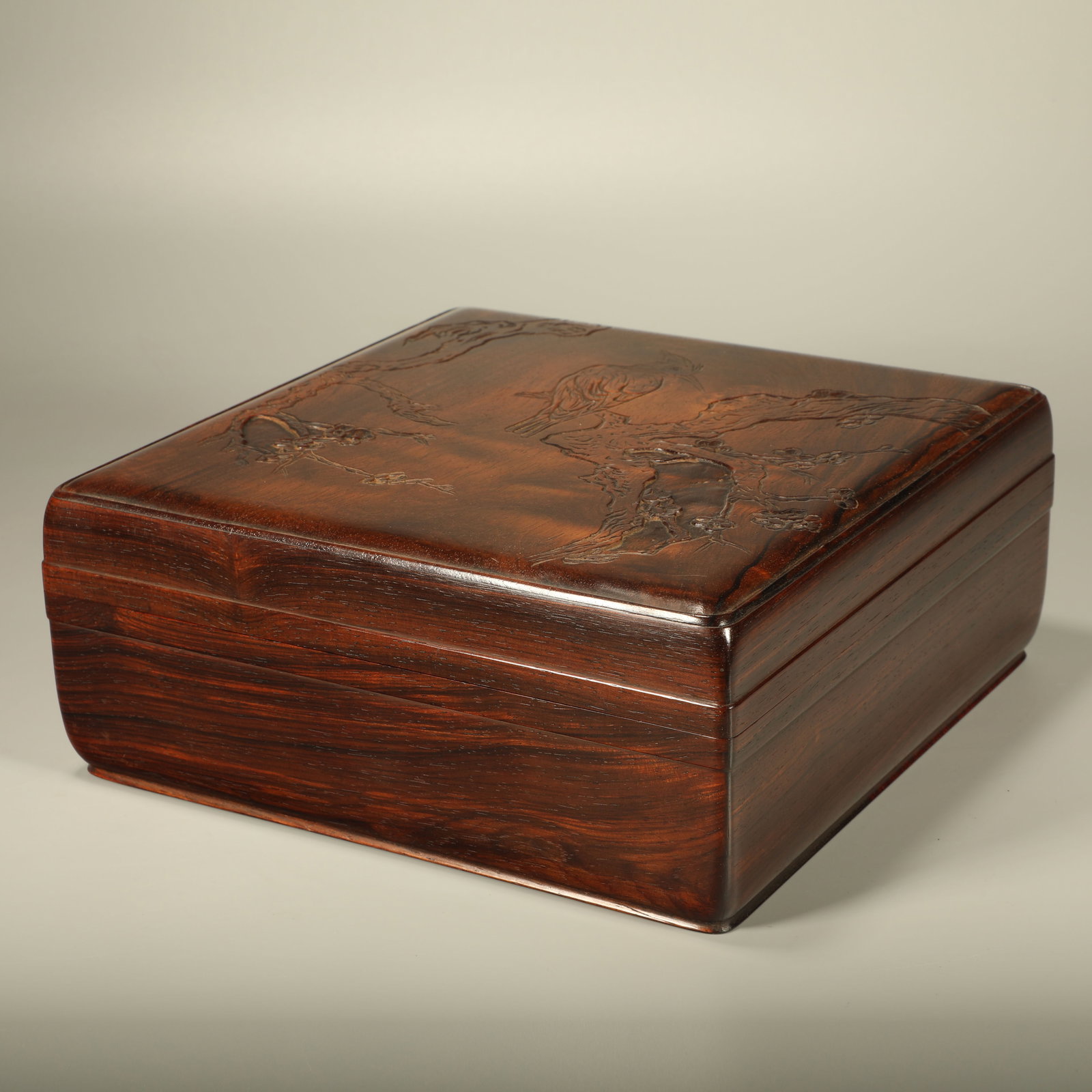 A HUANGHUALI BOX CARVED WITH FLOWER AND BIRD PATTERN: Huanghuali Box Carved with Flower and Bird Pattern