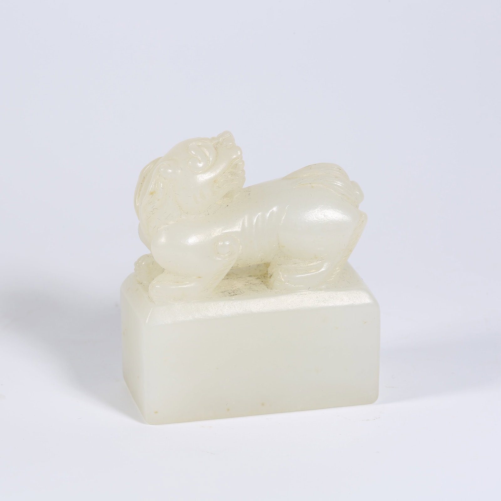 A HETIAN WHITE JADE SEAL WITH BEAST FINIAL: Hetian White Jade Seal with Beast Finial