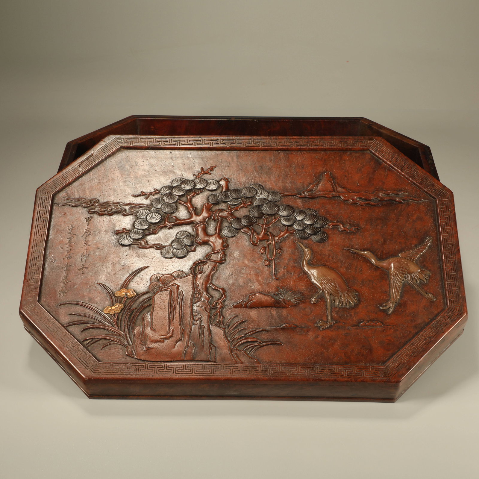 A HUANGHUALI COVERED BOX INLAID WITH CHERRY WOOD AND RED SANDALWOOD HORN CARVING OF PINE AND CRANE: Huanghuali Covered Box Inlaid with Cherry Wood and Red Sandalwood Horn Carving of Pine and Crane Pattern