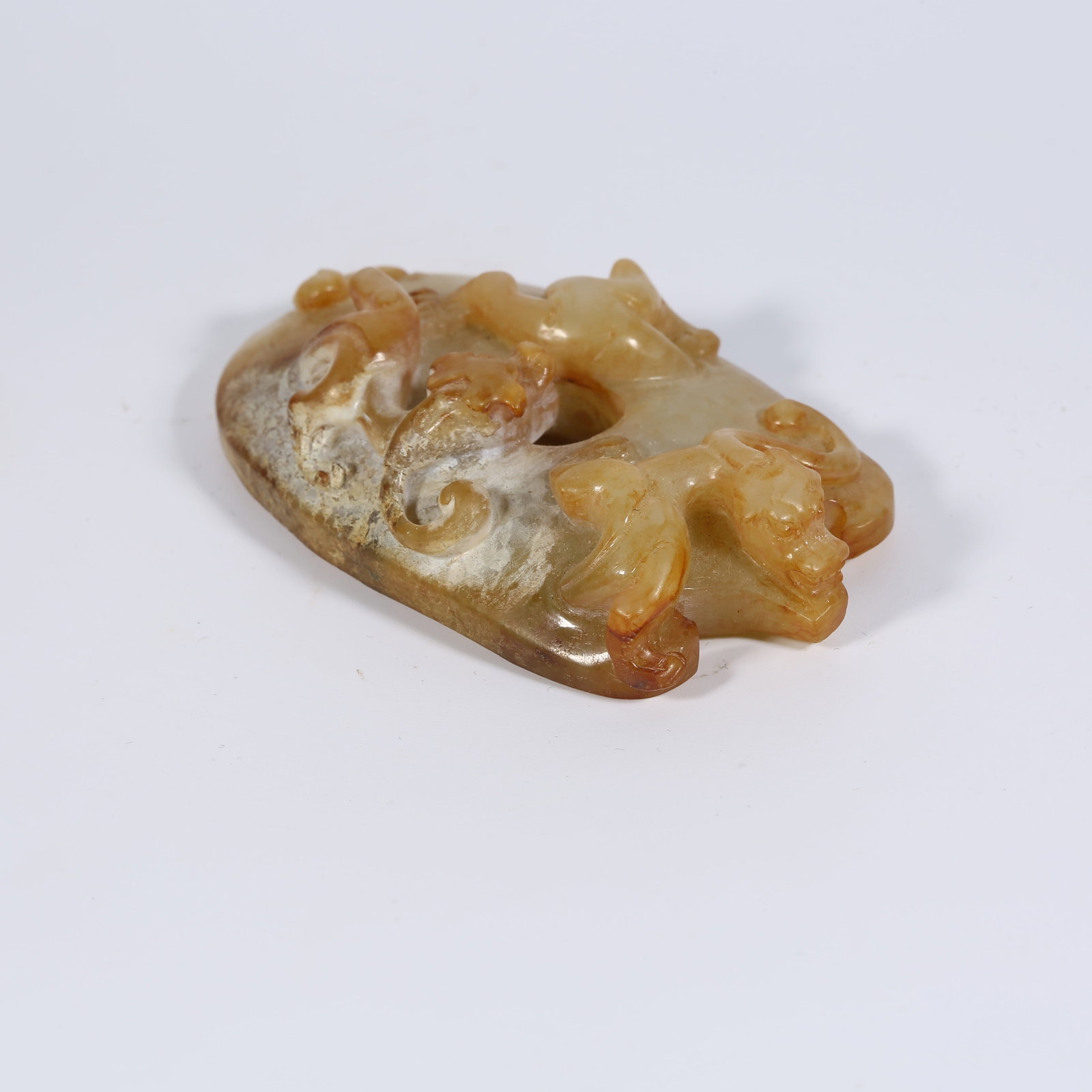 A ANCIENT JADE CHICKEN-HEART PENDANT WITH CHI-DRAGON MOTIF: Ancient Jade Chicken-Heart Pendant with Chi-Dragon Motif