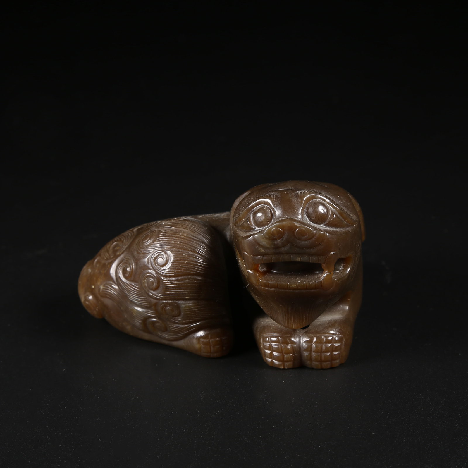 A HETIAN JADE LION ORNAMENT: Hetian Jade Lion Ornament