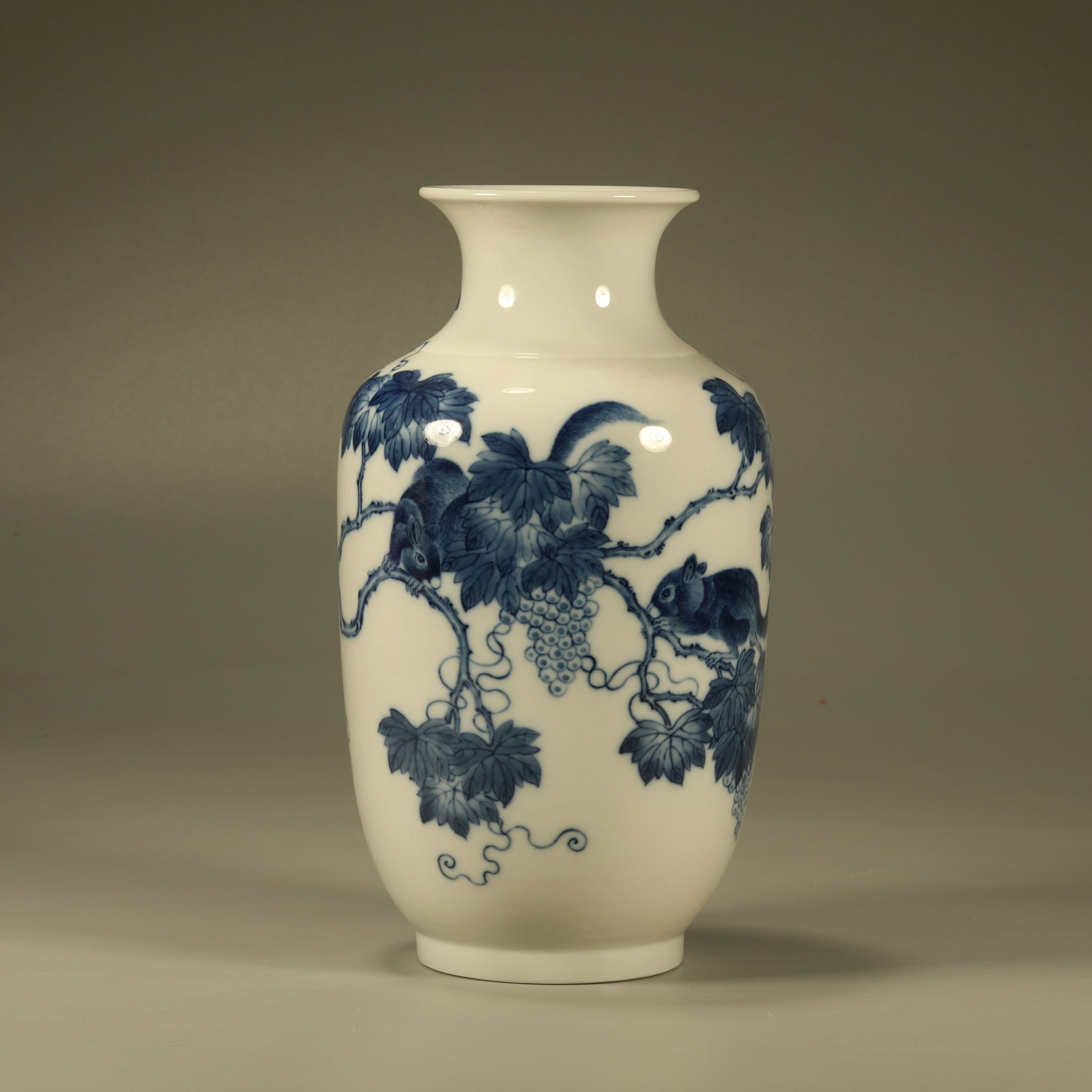 A BLUE AND WHITE LANTERN VASE WITH SQUIRREL AND GRAPE PATTERN (1 of 6)