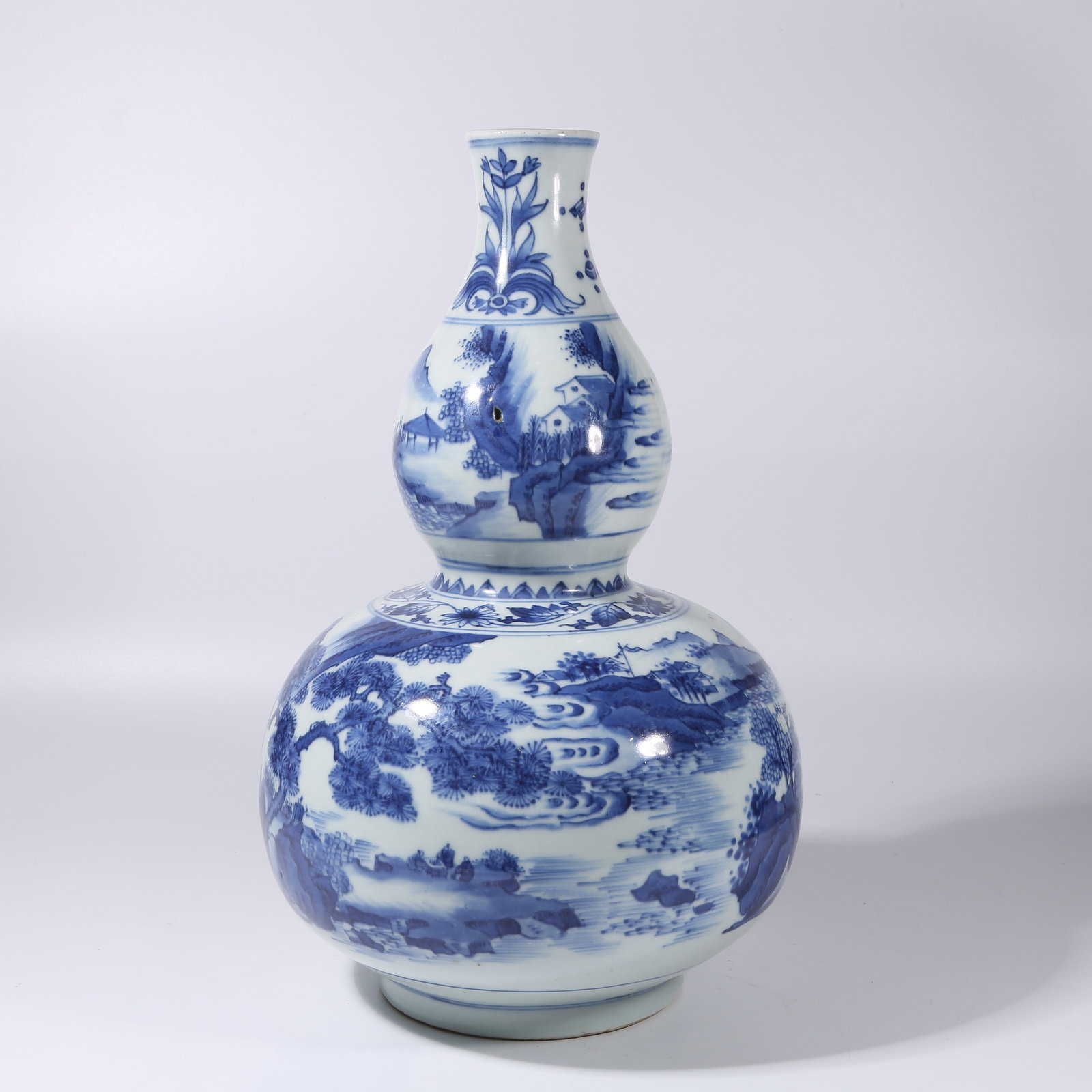 A BLUE-AND-WHITE LANDSCAPE GOURD VASE (1 of 9)