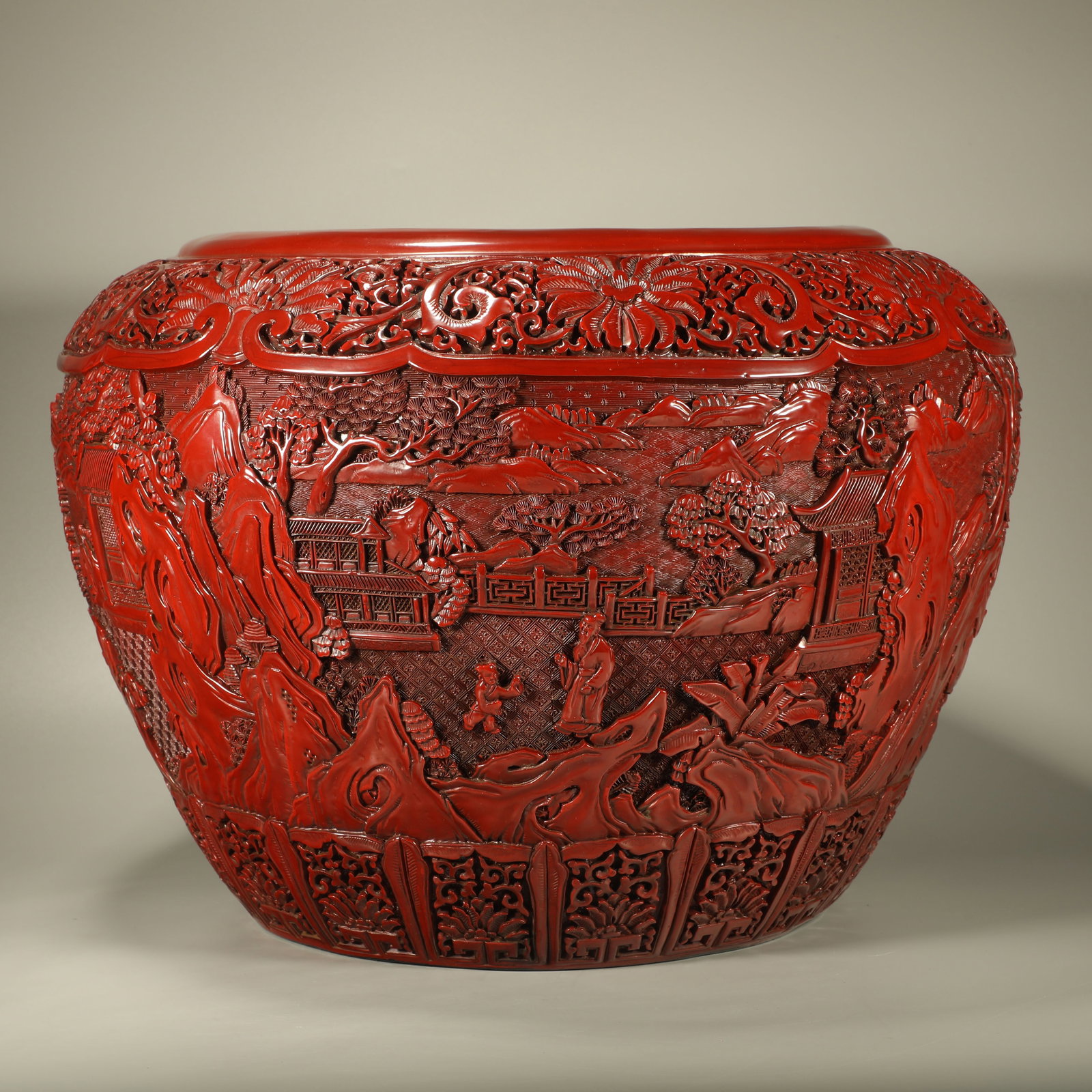 A LACQUER SCROLL CYLINDER WITH FLORAL PANELS ENCLOSING LANDSCAPE AND FIGURE MOTIFS: Lacquer Scroll Cylinder with Floral Panels Enclosing Landscape and Figure Motifs